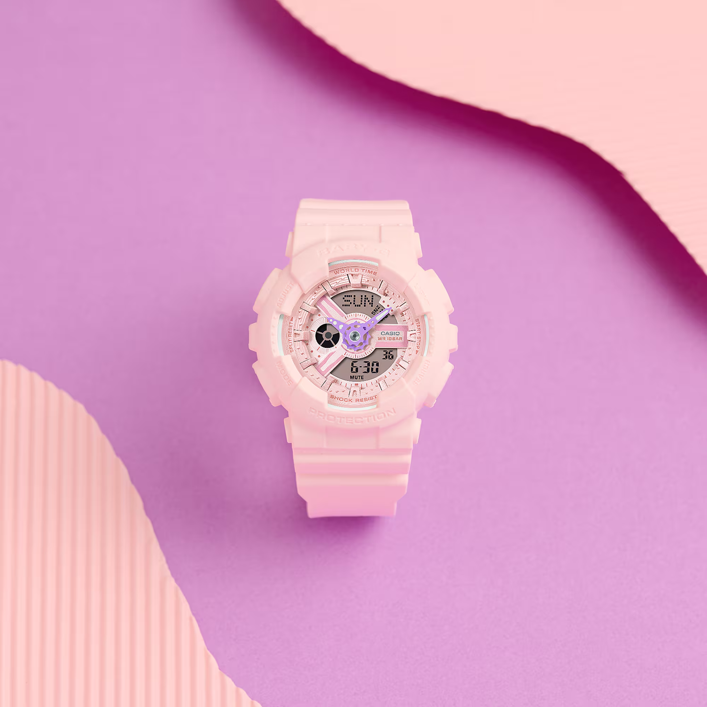Pink digital watch on a pink and purple background