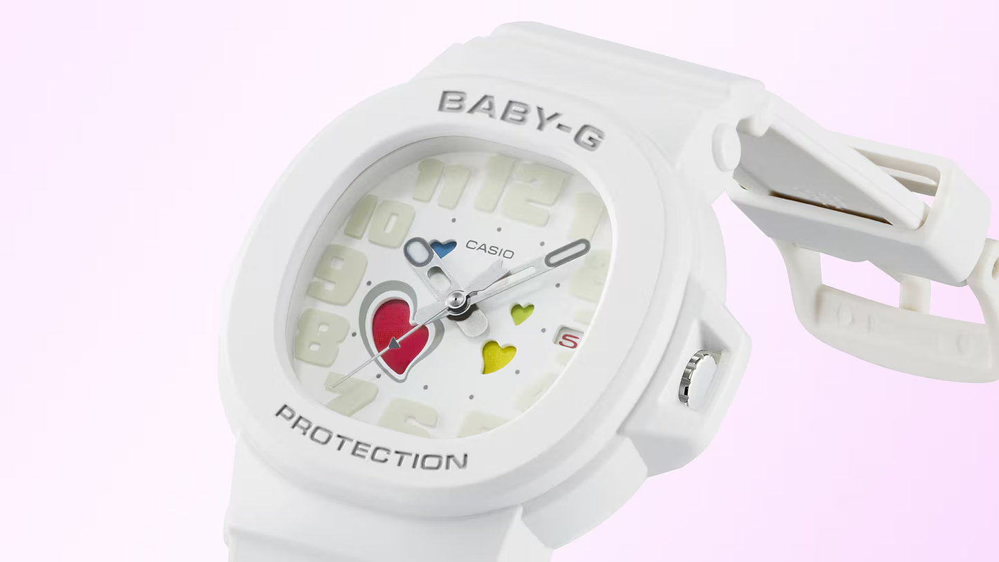 White Casio Baby-G watch with colorful heart designs on a light pink background