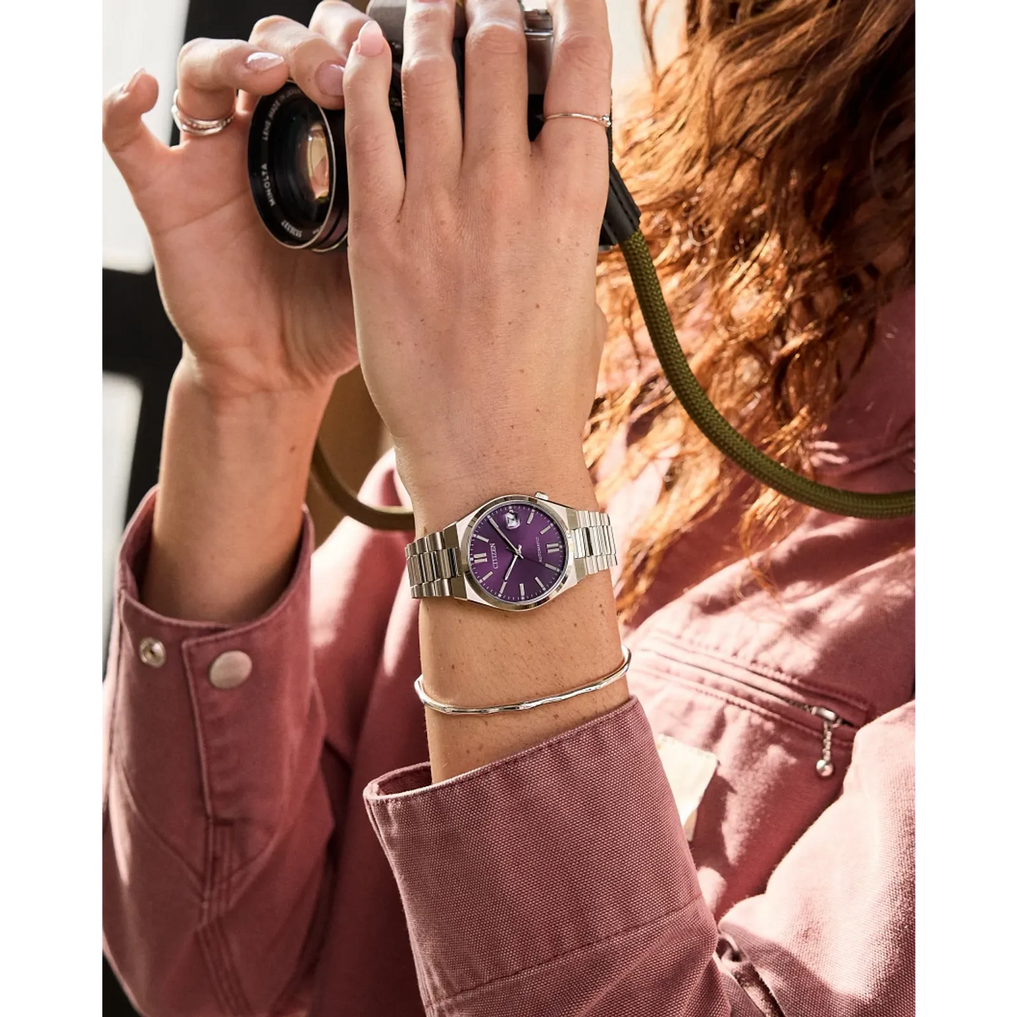 Citizen TSUYOSA NJ0200-50W – 37mm silver-tone stainless steel case, bold purple dial, automatic movement, sapphire crystal, and stainless steel bracelet with 50m water resistance.”