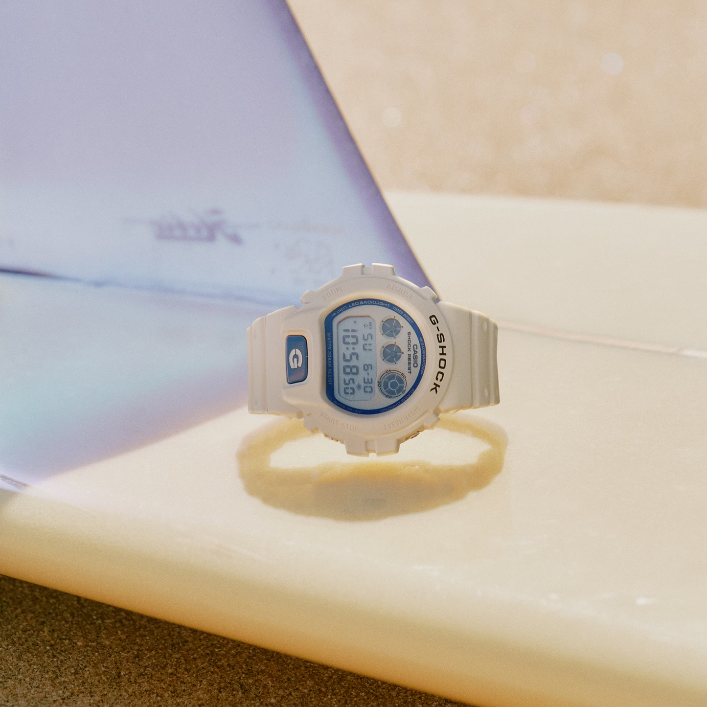 Casio G-SHOCK 6900 Series DW6900HDS-7 – classic white-and-blue design with phosphorescent dial, shock resistance, LED Super Illuminator, and 200m water resistance.
