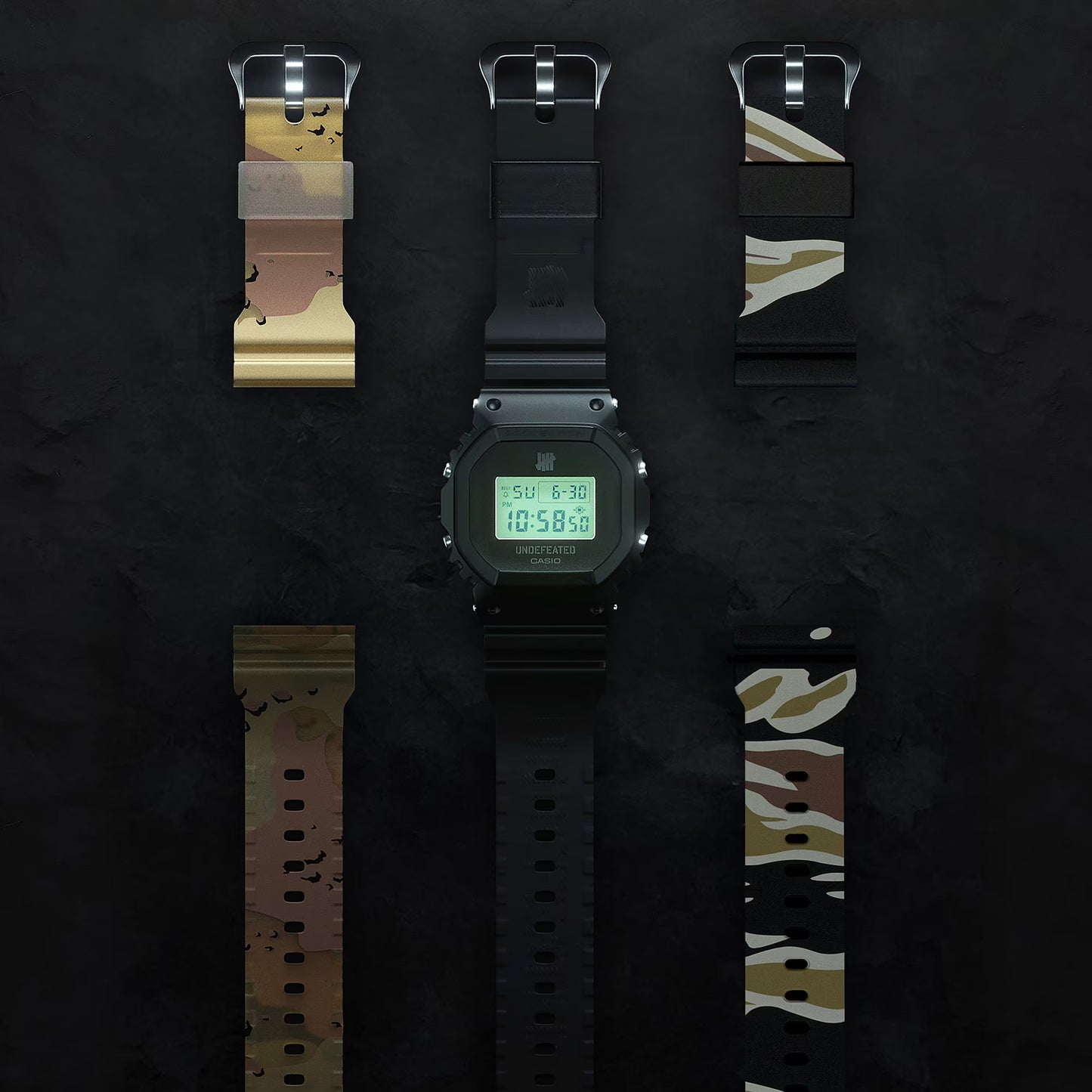 Digital watch with camouflage strap options on a dark background