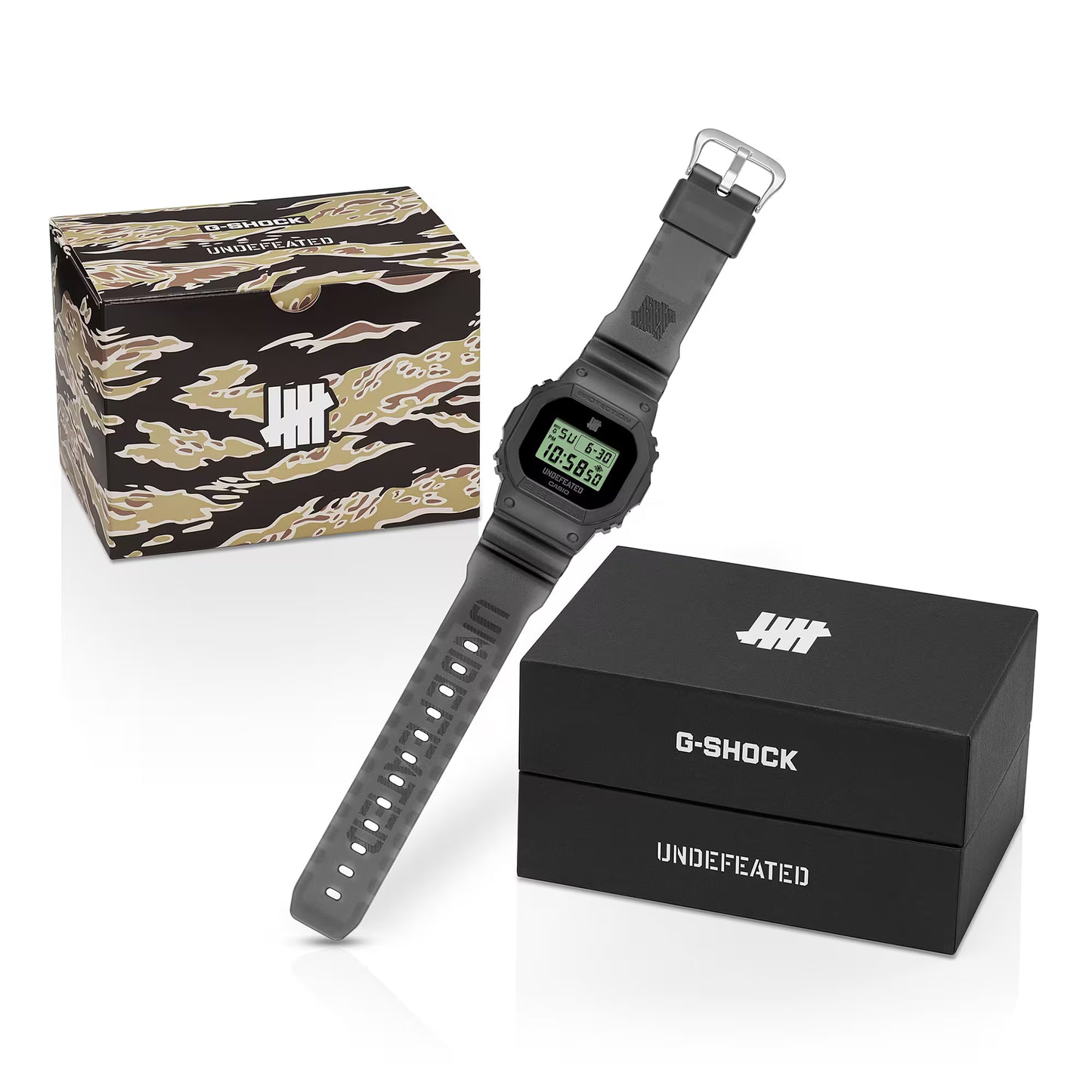 G-Shock digital watch with camouflage box and black branded box on a white background