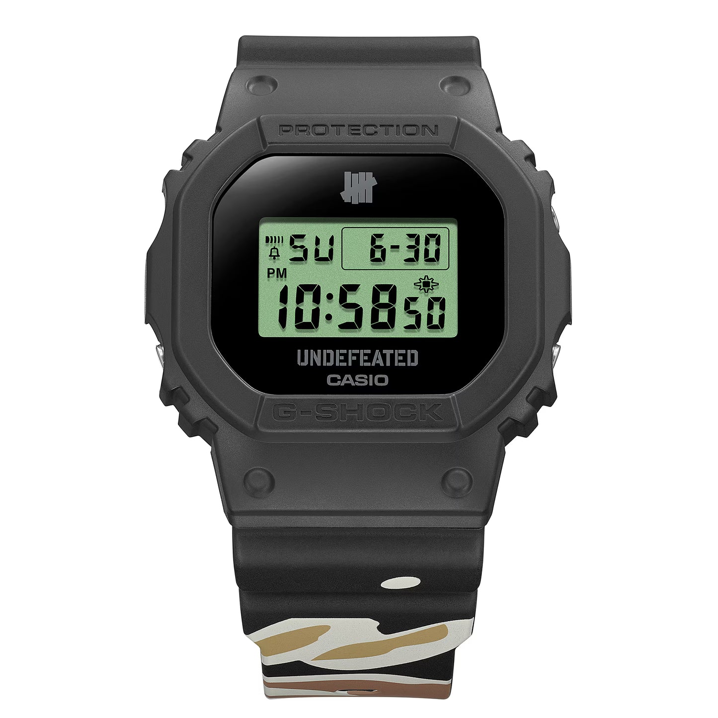 Casio G-SHOCK DWE5600UD-1 UNDEFEATED collaboration model with matte black Carbon Core Guard case, semi-translucent resin band featuring UNDEFEATED logo, green LCD display, engraved caseback, and special packaging. Includes two interchangeable camouflage straps (tiger camo, storm camo). Features shock resistance, mineral glass, 200m water resistance, LED Super Illuminator backlight, stopwatch, countdown timer, alarms, flash alert, auto-calendar, and ±15 sec/month accuracy. Case size 48.9 × 43.8 × 13.7 mm, we