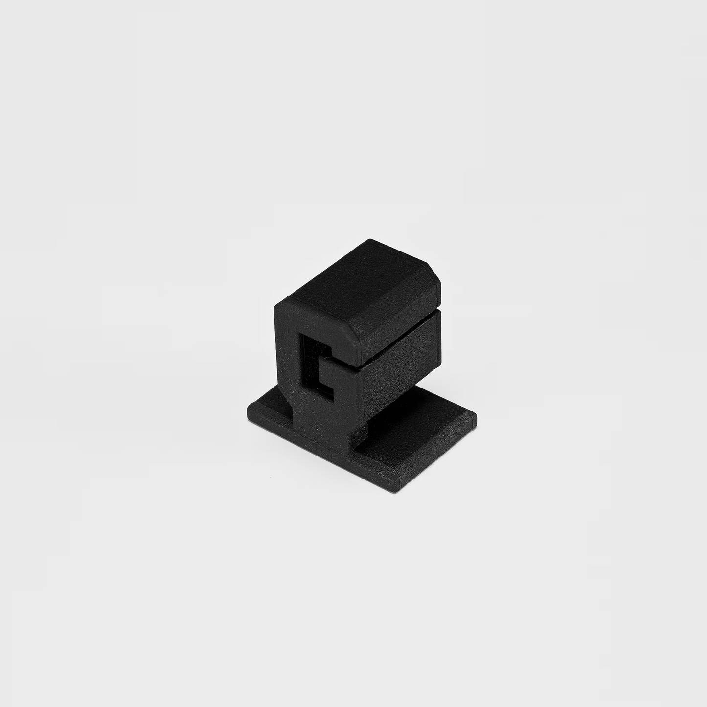 Black rectangular object on a light gray background