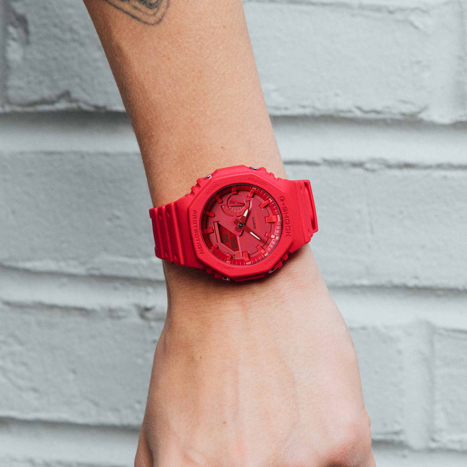 Casio G-Shock GA2100-4A watch in bold red with carbon core guard structure, octagonal bezel, analog-digital display, and resin band