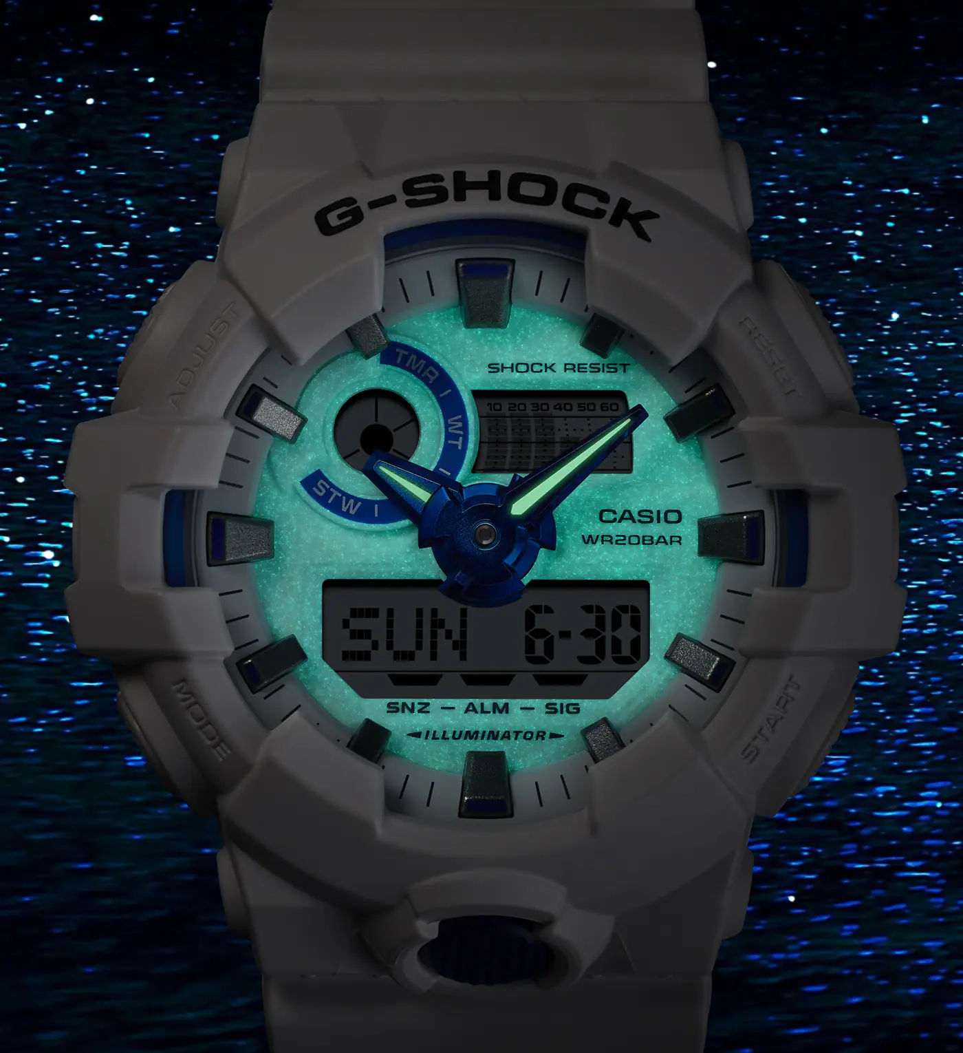G-Shock watch with a glowing face on a dark background