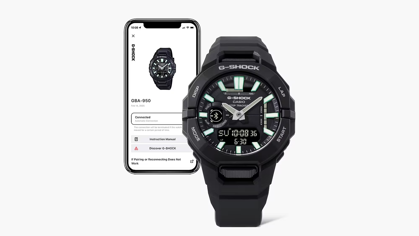 Black G-Shock watch next to a smartphone displaying the Casio app.
