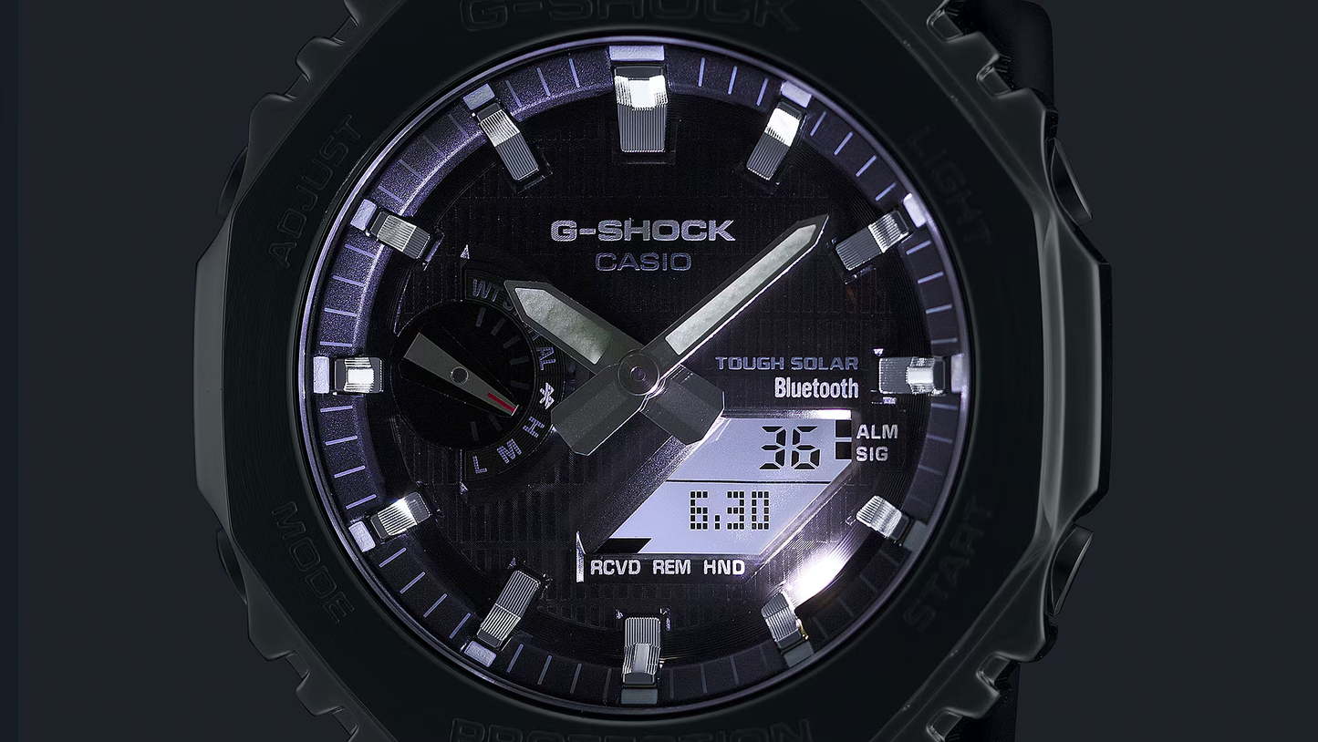 Casio G-Shock watch with black face and digital display on a dark background