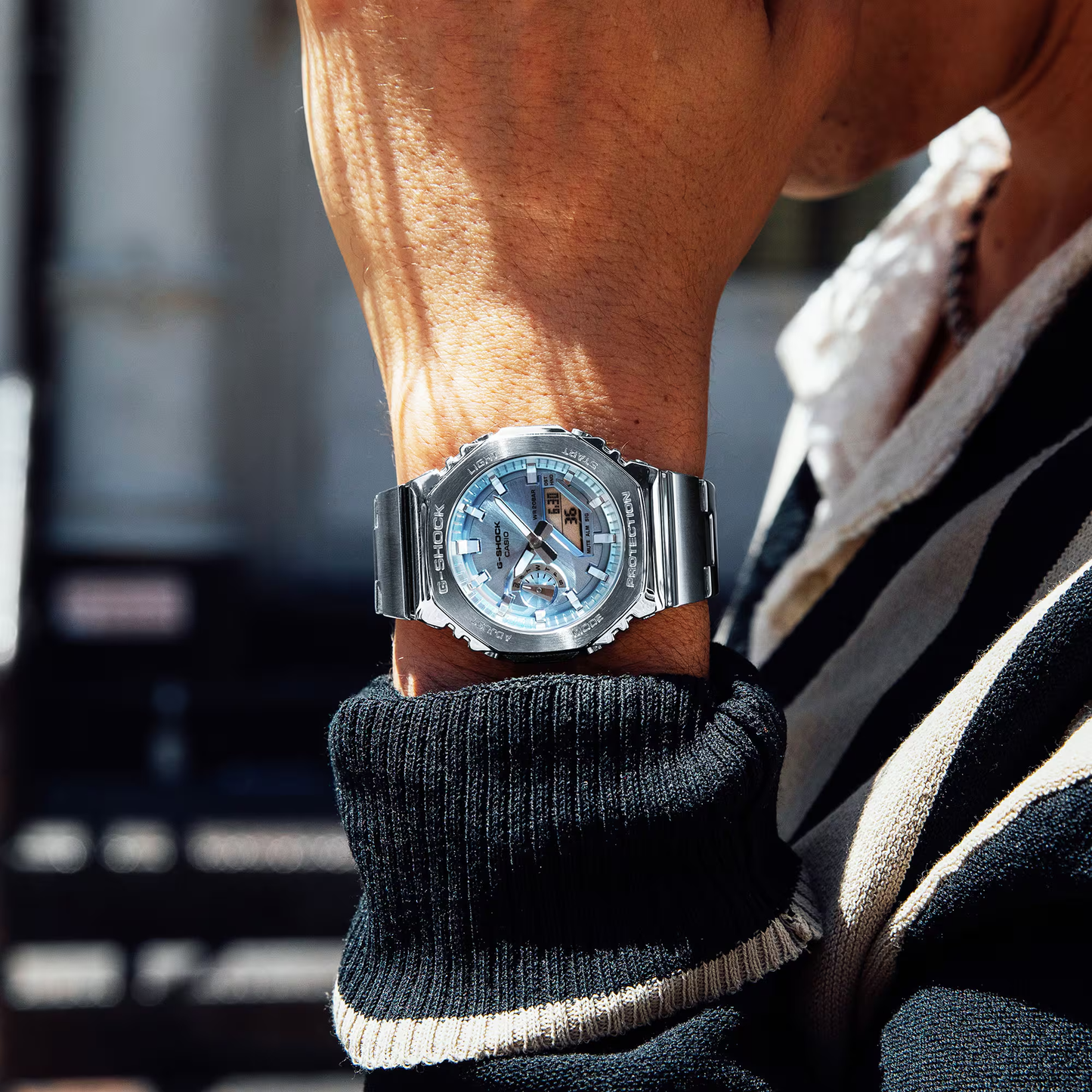 Casio G-STEEL GM2110D-2A, premium stainless-steel G-SHOCK with an octagonal bezel. Features a light blue metallic dial, shock resistance, 200m water resistance, dual LED Super Illuminator, and world time. Stylish and durable.