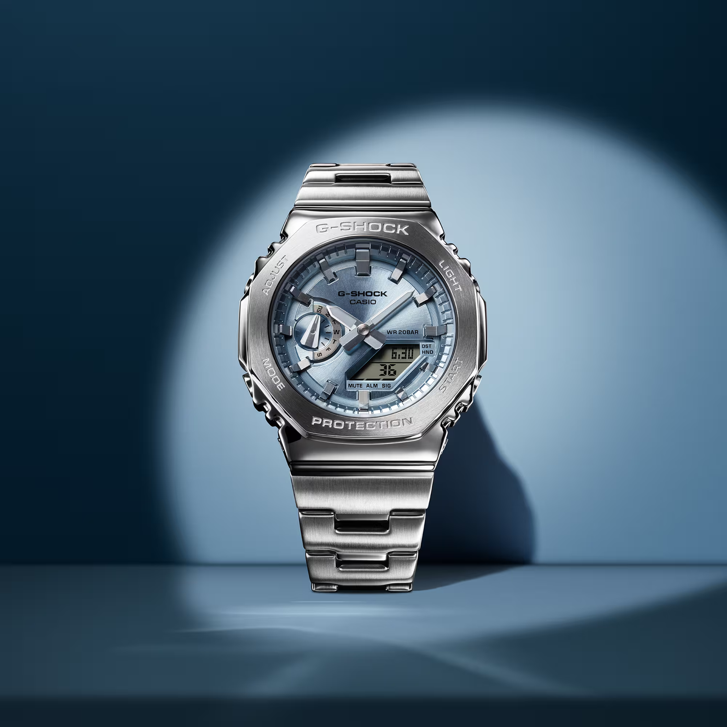 Casio G-STEEL GM2110D-2A, premium stainless-steel G-SHOCK with an octagonal bezel. Features a light blue metallic dial, shock resistance, 200m water resistance, dual LED Super Illuminator, and world time. Stylish and durable.