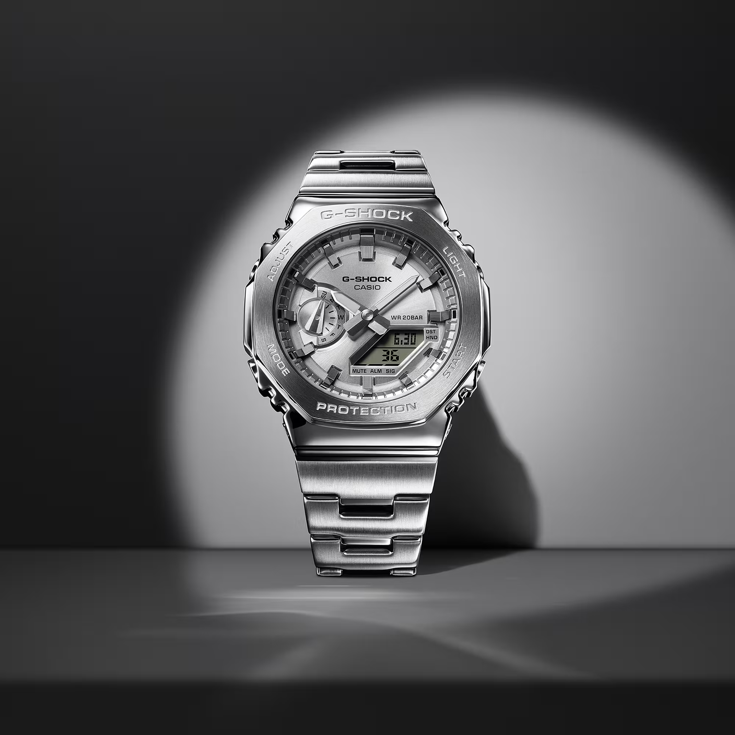 Casio G-STEEL GM2110D-7A, premium stainless-steel G-SHOCK with an octagonal bezel. Features a polished silver-tone dial, shock resistance, 200m water resistance, dual LED Super Illuminator, and world time. Stylish and durable.