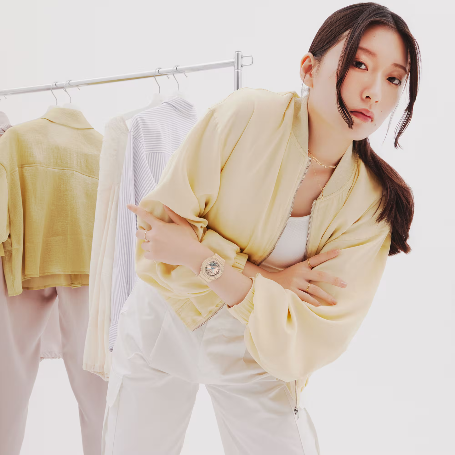 Woman in a yellow outfit with a white background
