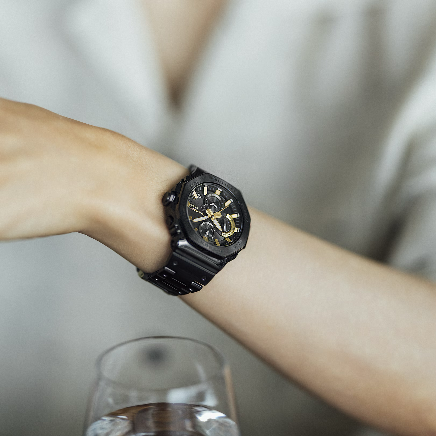 Casio G-SHOCK GMCB2100ZE1A 50th Anniversary full-metal black ion-plated watch with gold accent and binary code dial, limited edition released April 2025