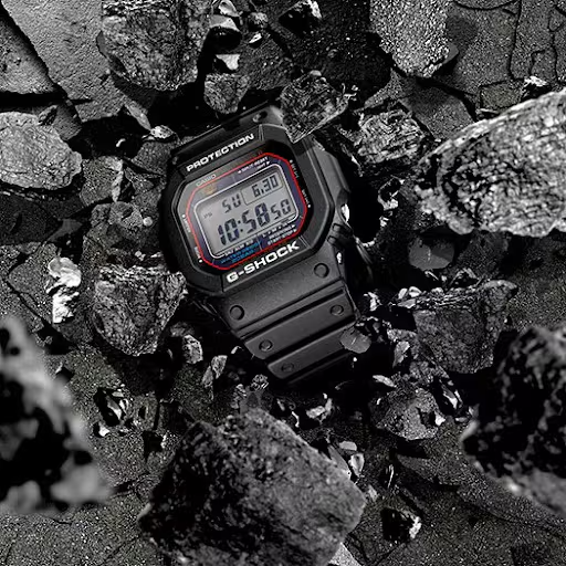 Casio G-Shock GWM5610-1 digital watch with a classic square design. Features solar power, Multi-Band 6 atomic timekeeping, 200m water resistance, shock resistance, and LED backlight.