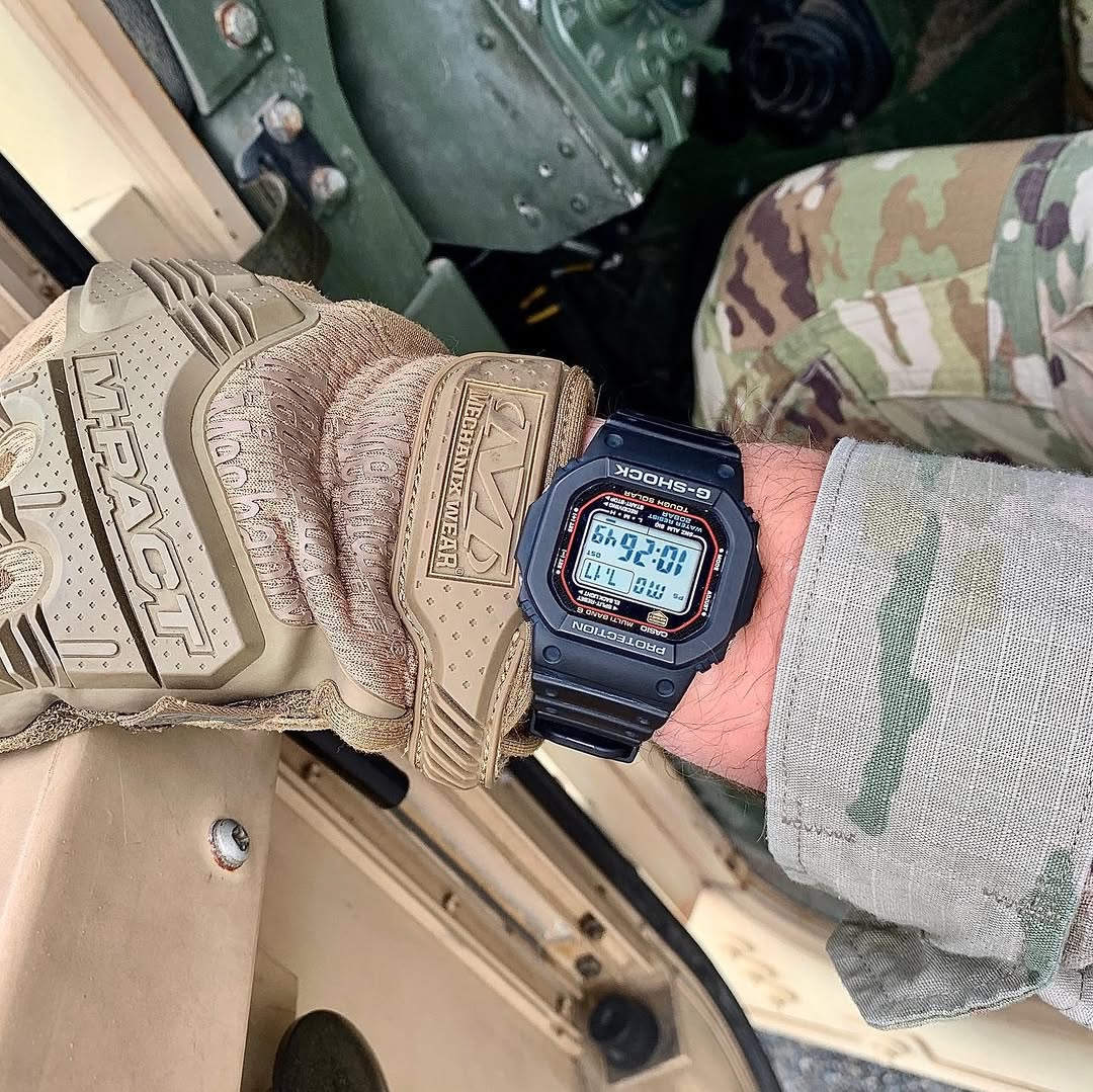 Casio G-Shock GWM5610-1 digital watch with a classic square design. Features solar power, Multi-Band 6 atomic timekeeping, 200m water resistance, shock resistance, and LED backlight.