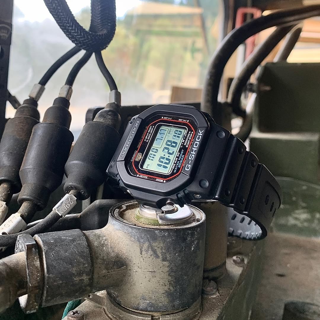 Casio G-Shock GWM5610-1 digital watch with a classic square design. Features solar power, Multi-Band 6 atomic timekeeping, 200m water resistance, shock resistance, and LED backlight.