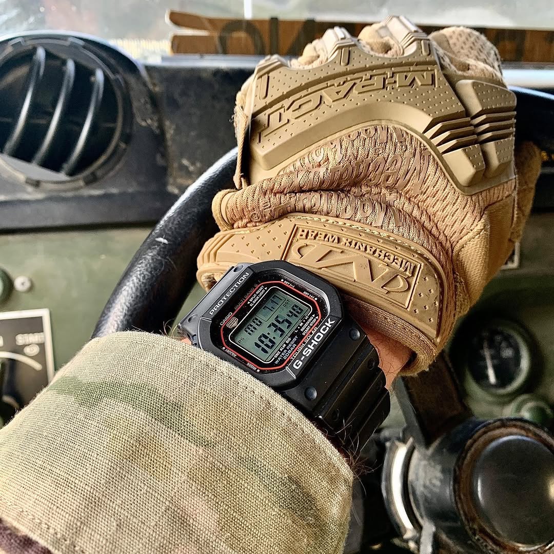 Casio G-Shock GWM5610-1 digital watch with a classic square design. Features solar power, Multi-Band 6 atomic timekeeping, 200m water resistance, shock resistance, and LED backlight.