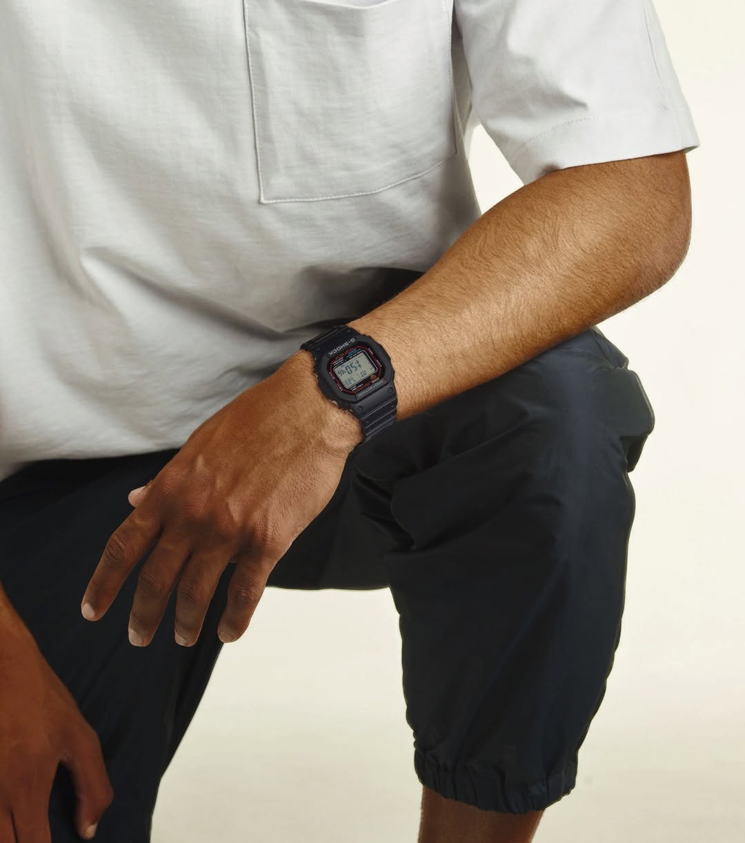 Casio G-Shock GWM5610-1 digital watch with a classic square design. Features solar power, Multi-Band 6 atomic timekeeping, 200m water resistance, shock resistance, and LED backlight.