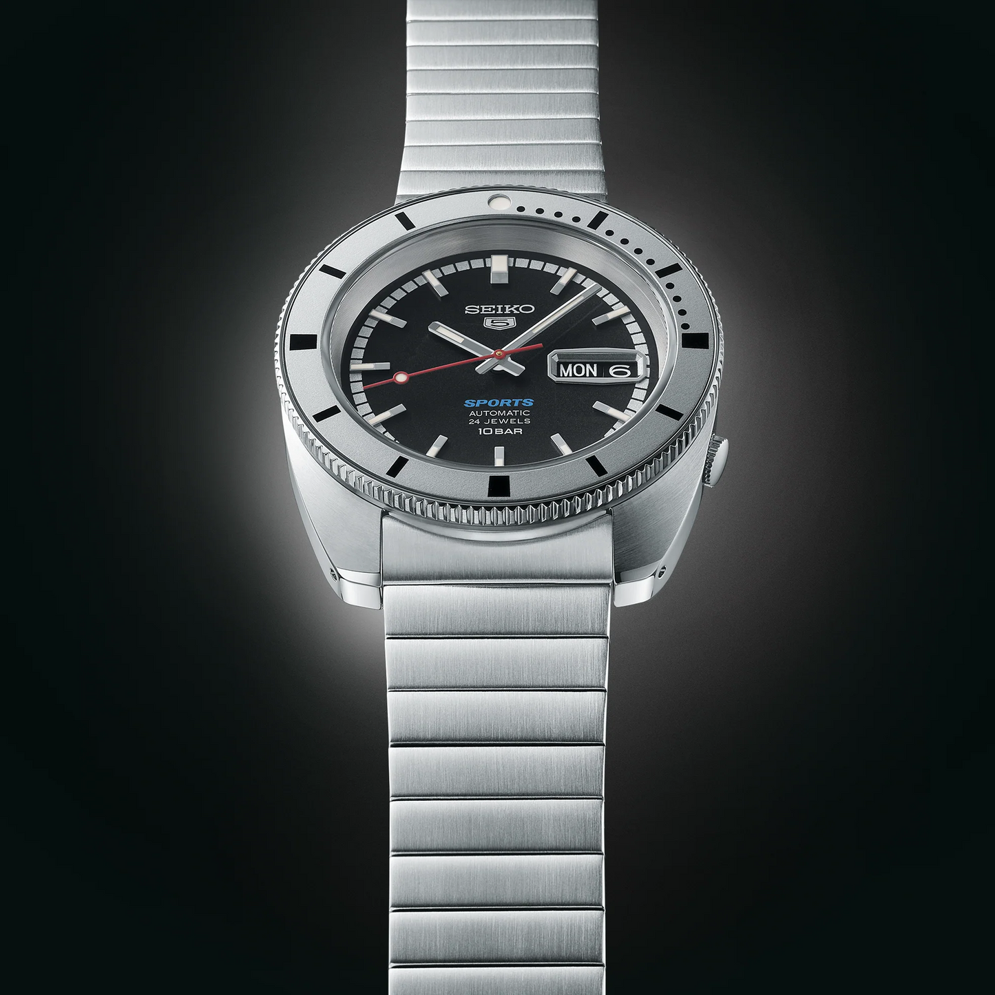 Seiko 5 Sports SRPL05 Limited Edition – vintage-inspired black dial with red second hand, silver rotating bezel, automatic movement, stainless steel and leather straps, 100m water resistance.