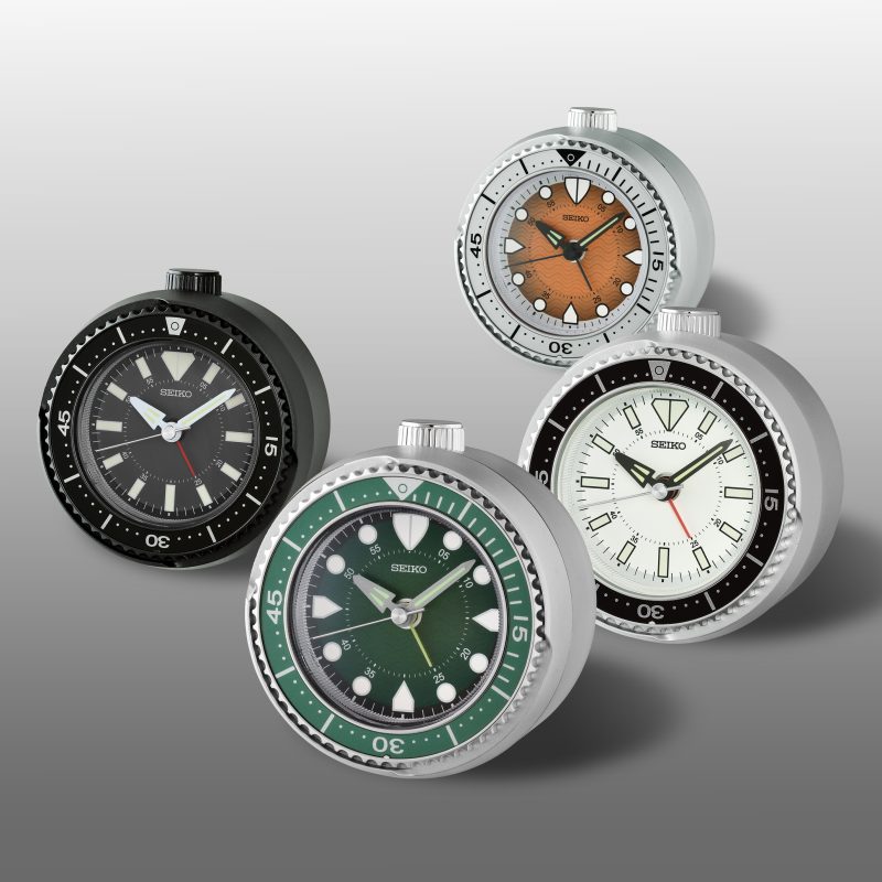 SEIKO rotating bezel alarm clock collection featuring four sporty heritage-inspired desk clocks in different dial and case colors.