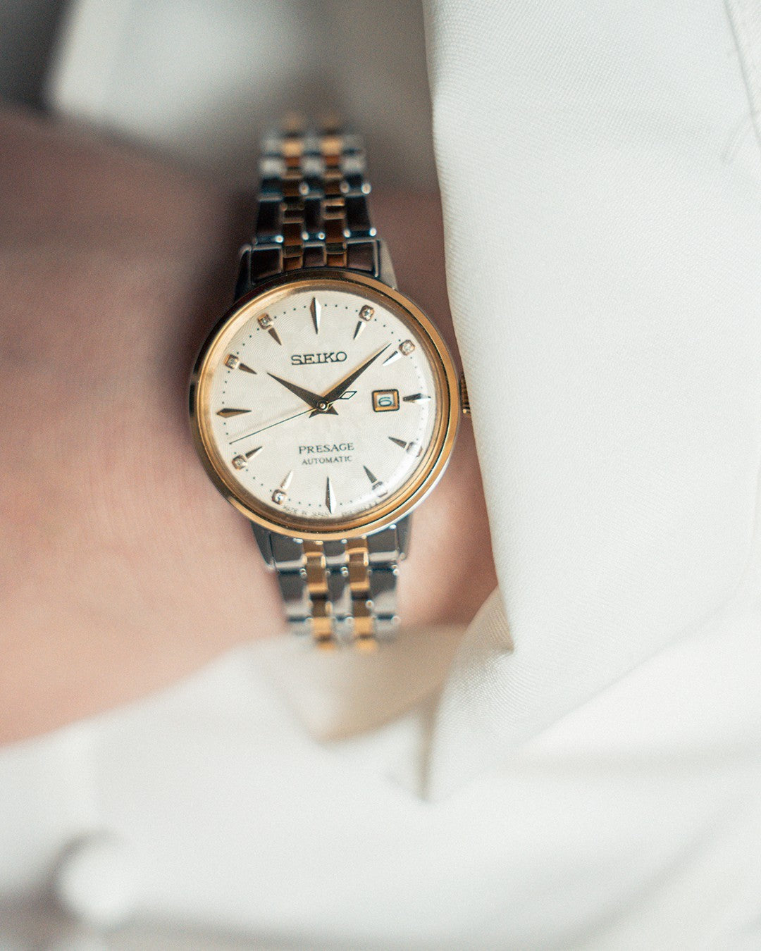 Seiko Presage SRE010 - 30.3mm Two-Tone Stainless Steel Cocktail Time Watch, Champagne Dial with 8 Diamonds, Gold-Tone Markers, 50m Water Resistance, Automatic Movement
