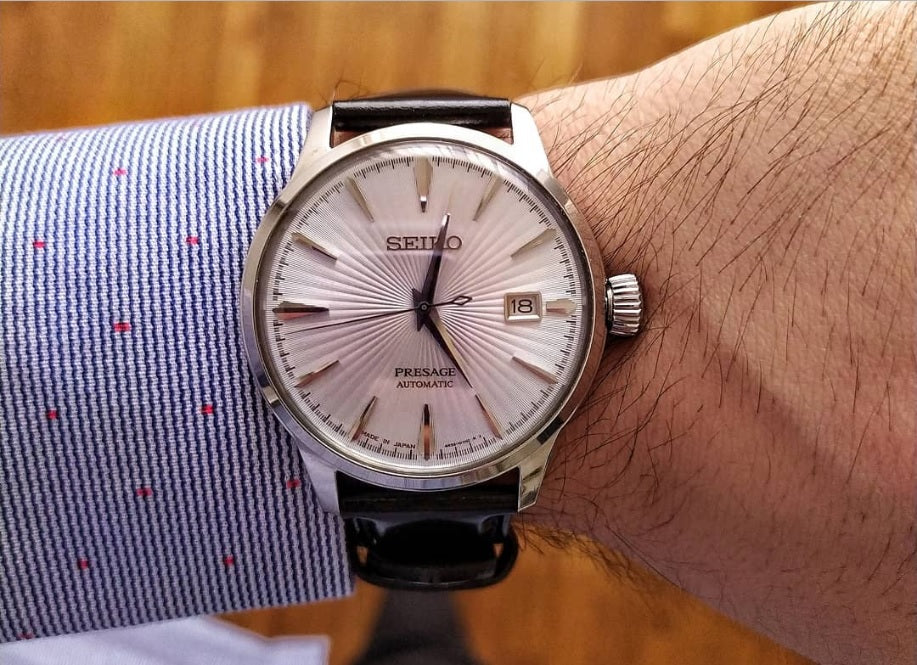 SEIKO Presage Cocktail Time – light blue dial with pressed pattern and gloss finish, black leather strap, automatic movement with 41-hour power reserve, and 50m water resistance.