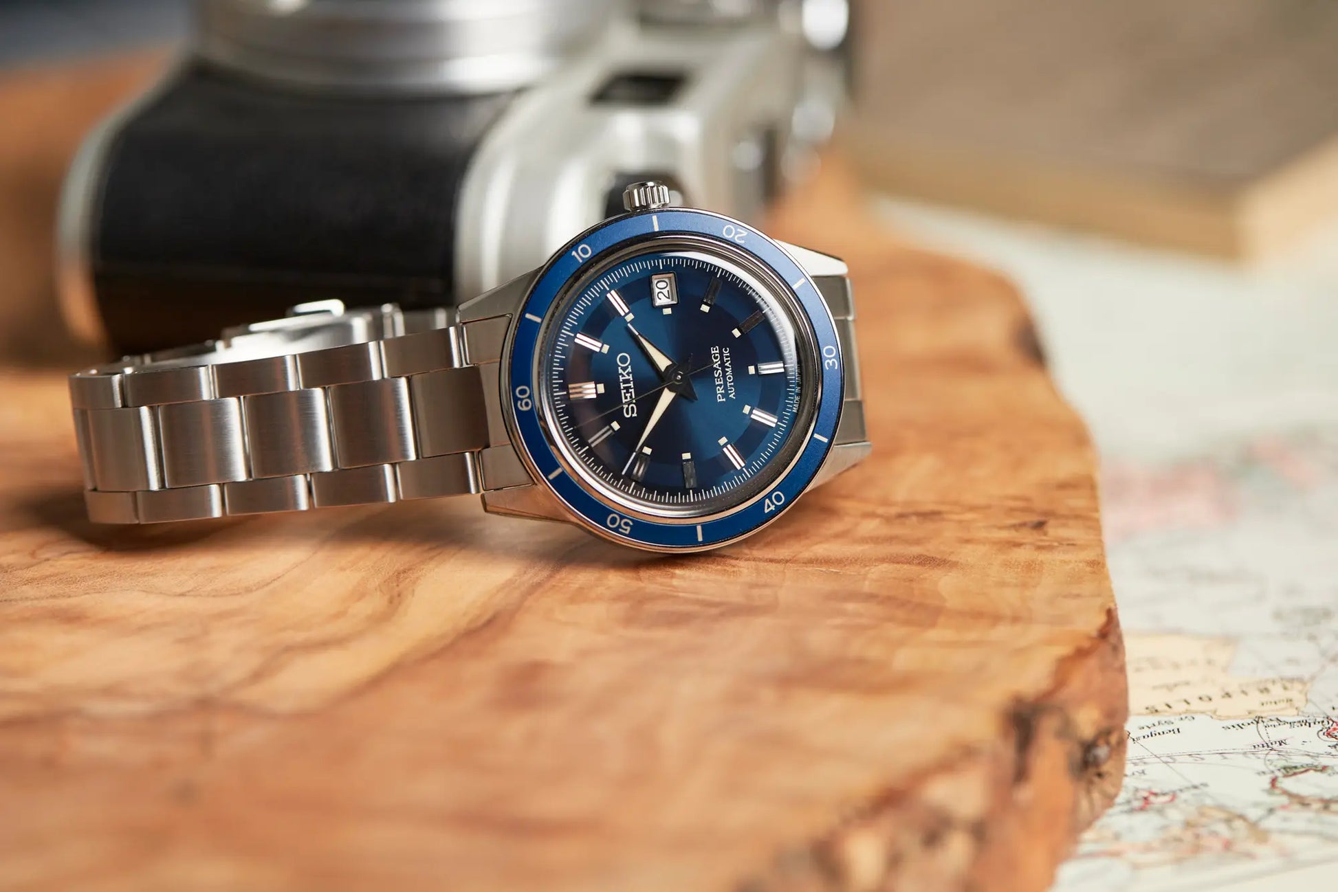 SEIKO SRPG05 from the Presage Style60’s Collection – blue sunray dial with rose gold-accented bezel, beige LumiBrite hands, stainless steel bracelet, automatic 23-jewel movement, and 50m water resistance.