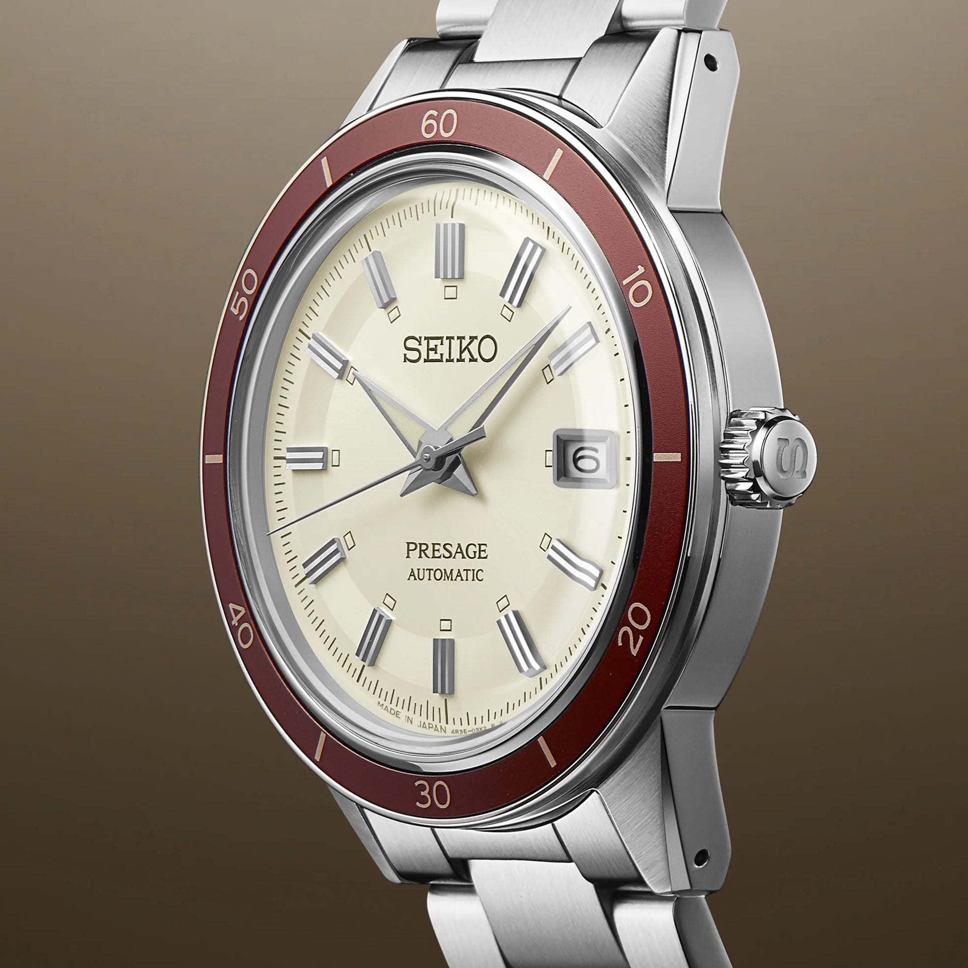 SEIKO SRPH93 from the Presage Style60’s Collection – ivory sunray dial, matte red bezel, stainless steel bracelet, automatic 23-jewel movement, and 50m water resistance.
