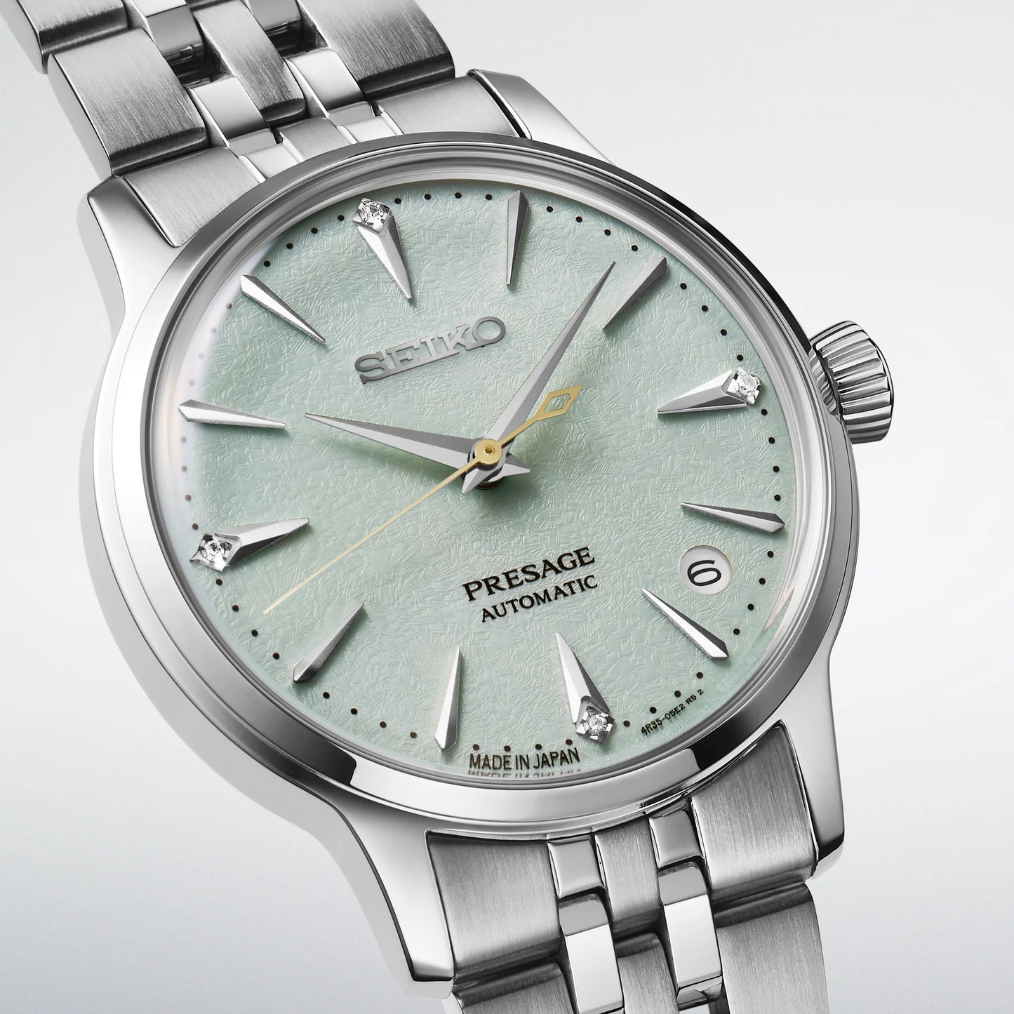 SEIKO Presage SRPL63 Cocktail Time – light green ice-textured dial with four diamonds, stainless steel case and bracelet, automatic movement, and 50m water resistance.