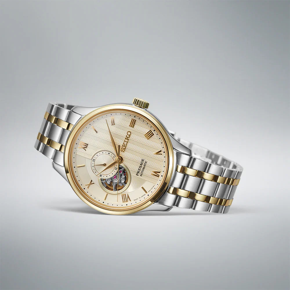 Seiko Presage SSA464 Japanese Garden – ivory-gold dial automatic watch with open-heart display, 24-hour sub-dial, dual-curved sapphire crystal, two-tone bracelet, and see-through caseback.