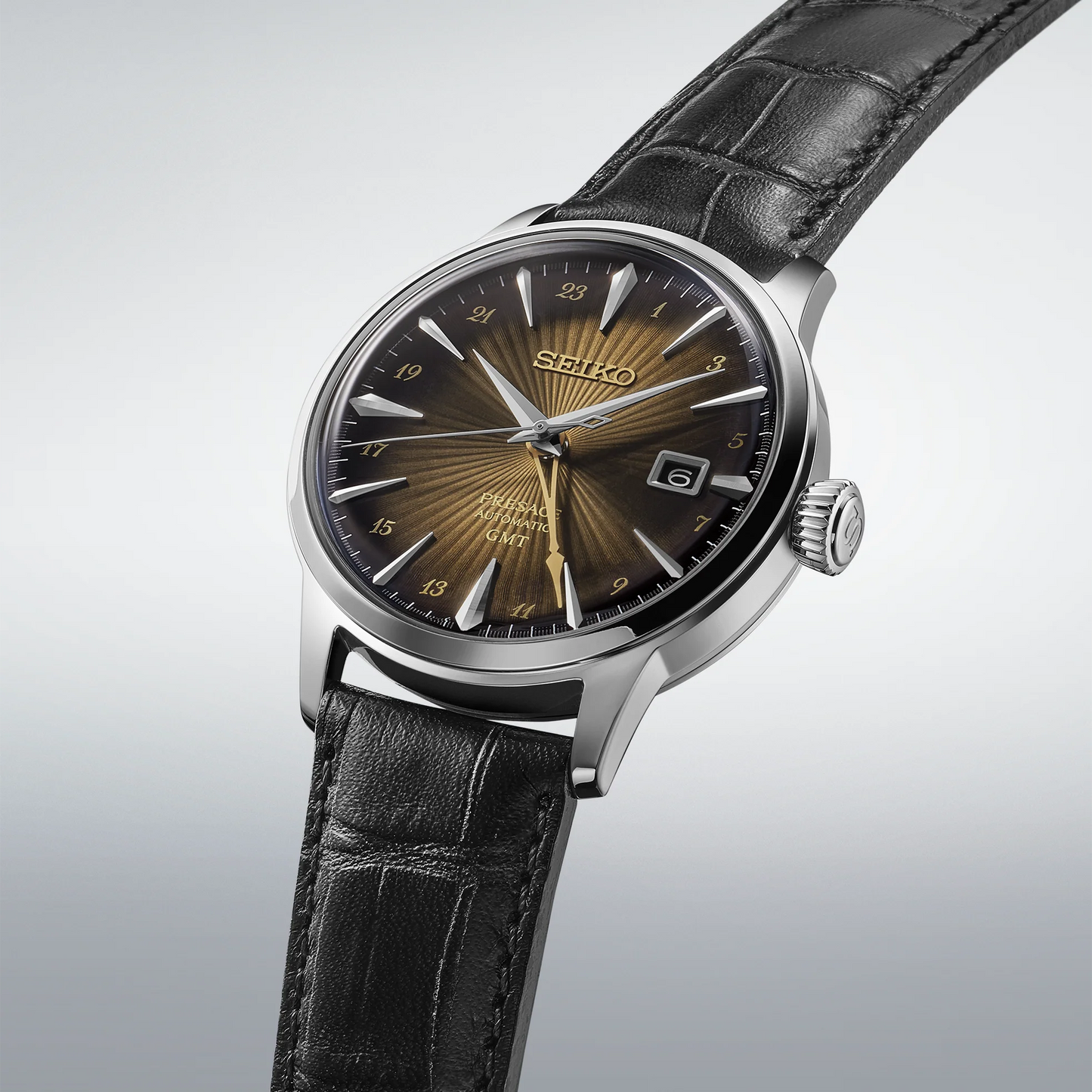 SEIKO SSK039 Presage Cocktail Time GMT – brown sunburst dial inspired by the Rusty Nail cocktail, gold-tone GMT hand, black leather strap, automatic movement, and 50m water resistance.