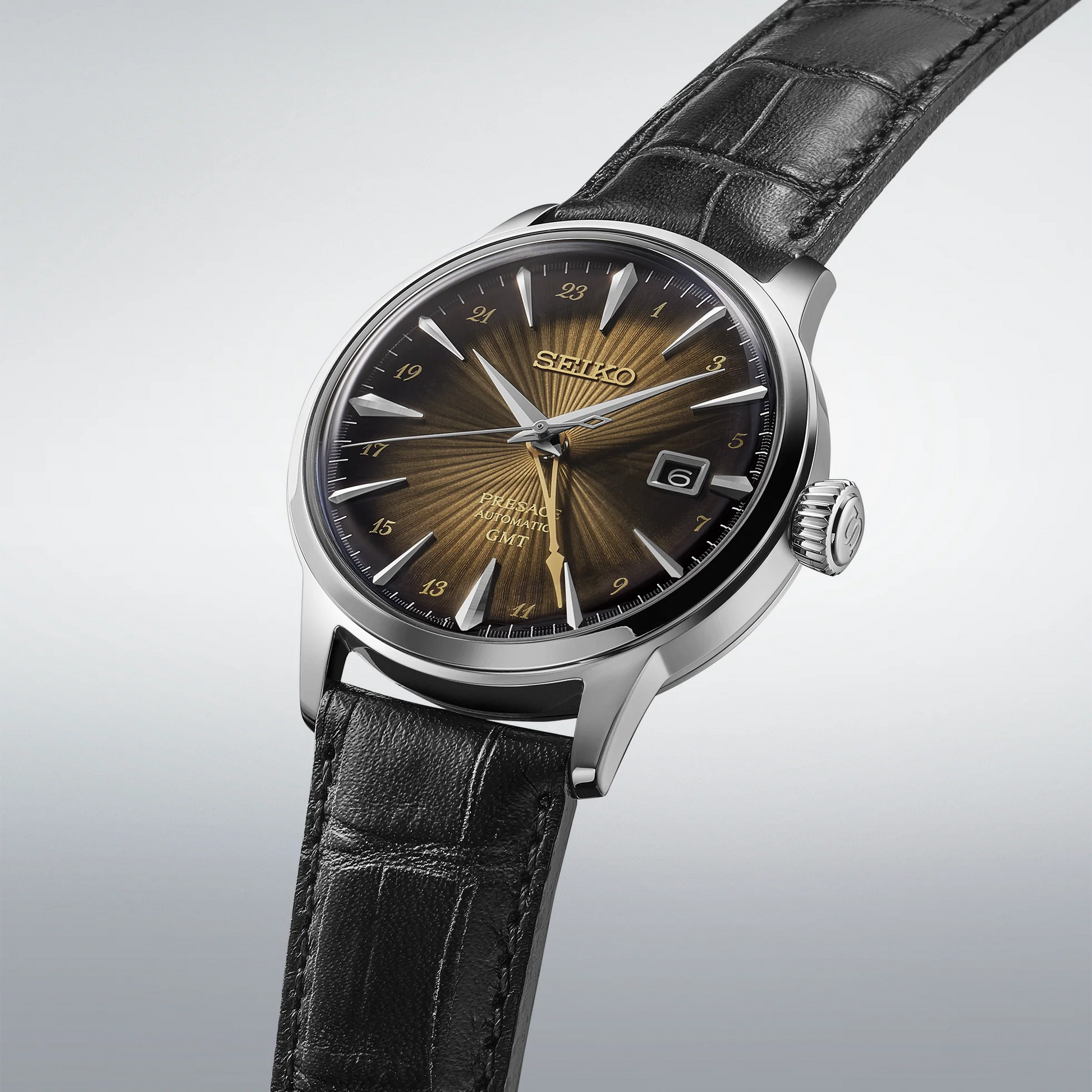 SEIKO SSK039 Presage Cocktail Time GMT – brown sunburst dial inspired by the Rusty Nail cocktail, gold-tone GMT hand, black leather strap, automatic movement, and 50m water resistance.