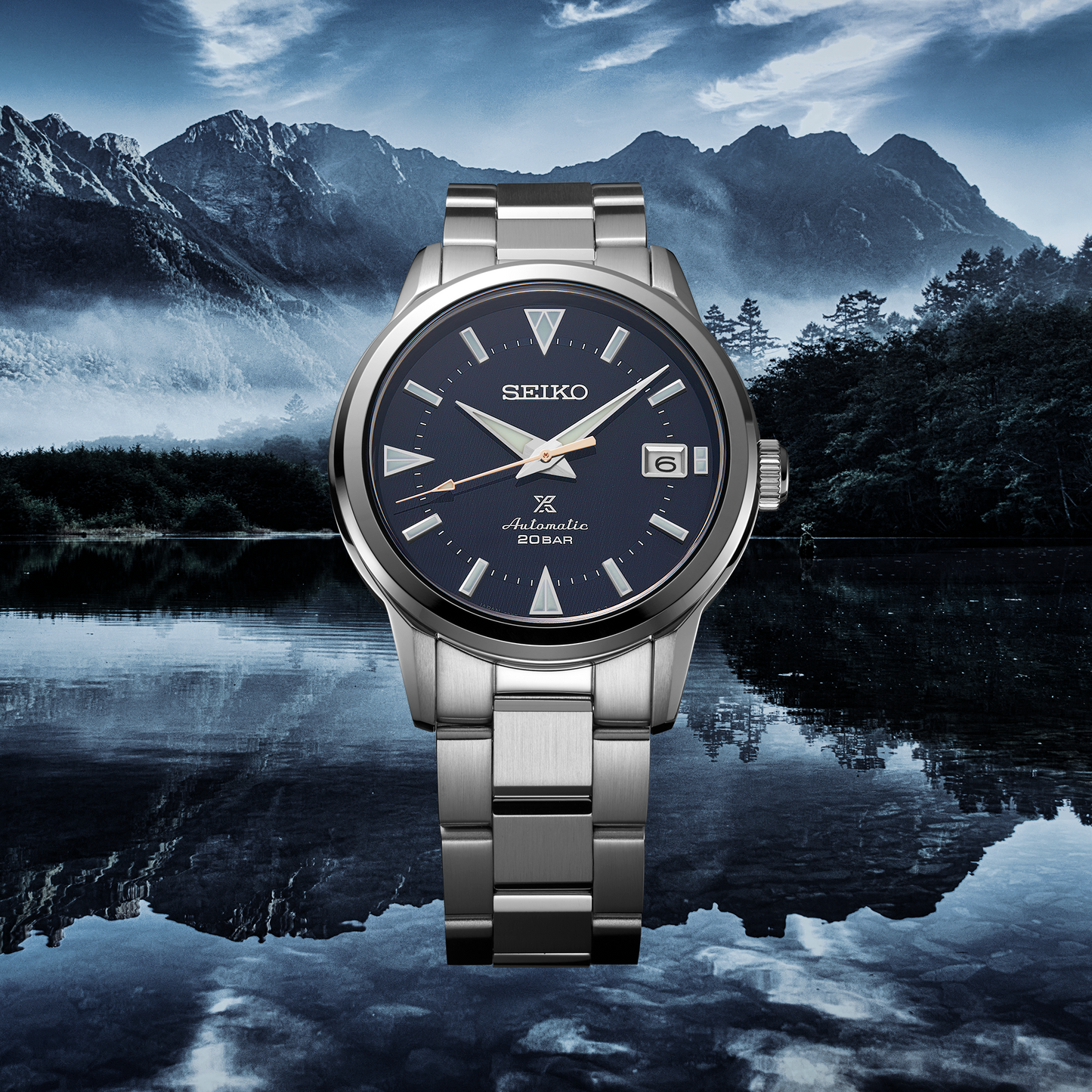 SEIKO Prospex SPB249 Alpinist – blue patterned dial with mountain-shaped markers, stainless steel case and bracelet, curved sapphire crystal, automatic movement, and 200m water resistance.