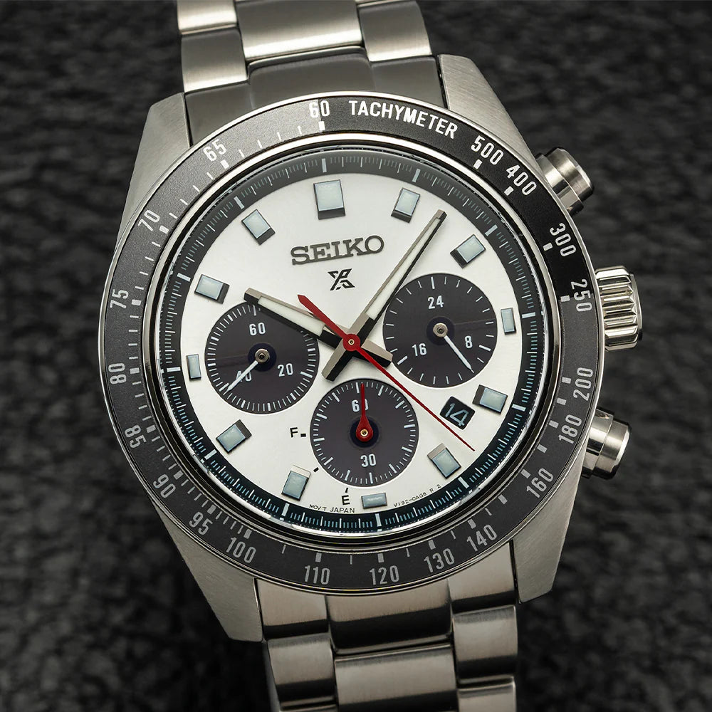 Seiko SSC911 – Prospex Speedtimer Solar Chronograph with silver sunray dial, black subdials, red chronograph hand, and black/gray tachymeter bezel; solar-powered with stainless steel bracelet.