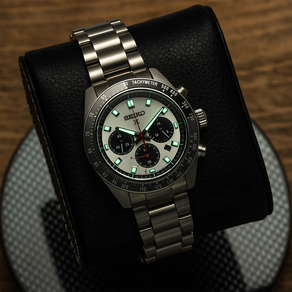 Seiko SSC911 – Prospex Speedtimer Solar Chronograph with silver sunray dial, black subdials, red chronograph hand, and black/gray tachymeter bezel; solar-powered with stainless steel bracelet.