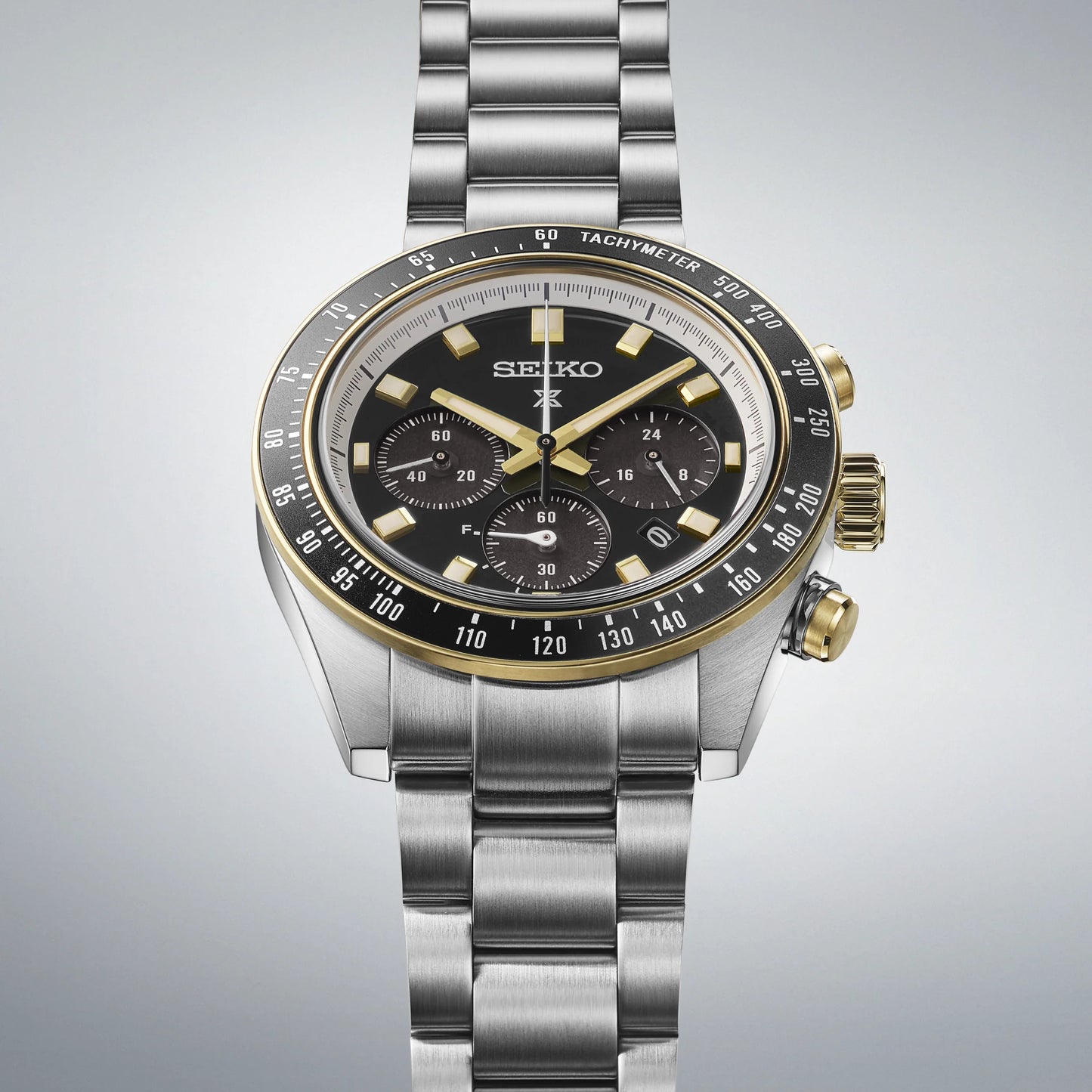 Seiko SSC941 – Prospex Speedtimer Solar Chronograph with black dial, gold accents, black tachymeter bezel, and two-tone stainless steel case; motorsport-inspired solar-powered design with chronograph functions.”