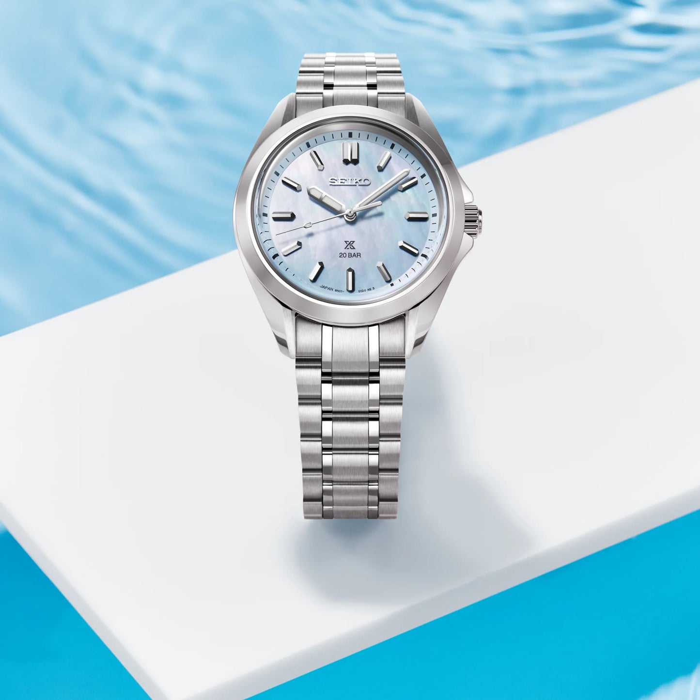 SEIKO Prospex SUR607 Sea Series – 34mm stainless steel case, light blue mother-of-pearl dial, curved sapphire crystal, quartz movement, and 200m water resistance.