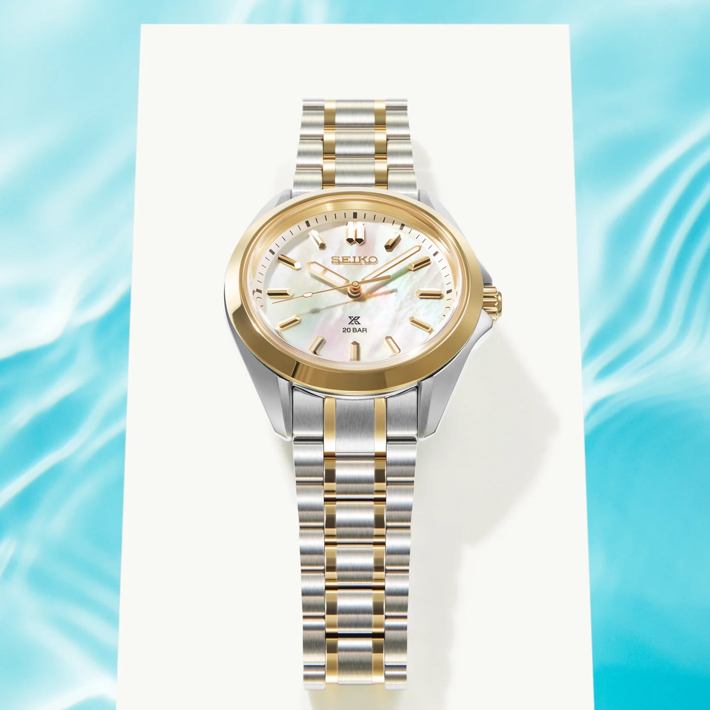 SEIKO Prospex SUR608 Sea Series – 34mm two-tone stainless steel case and bracelet, white mother-of-pearl dial with gold accents, curved sapphire crystal, quartz movement, and 200m water resistance.