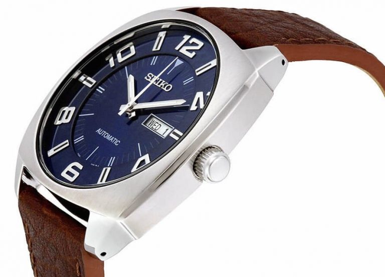Seiko SNKN37 Recraft – bold blue dial automatic watch with retro cushion-shaped case, brown leather strap, luminous markers, see-through caseback, and 41-hour power reserve.