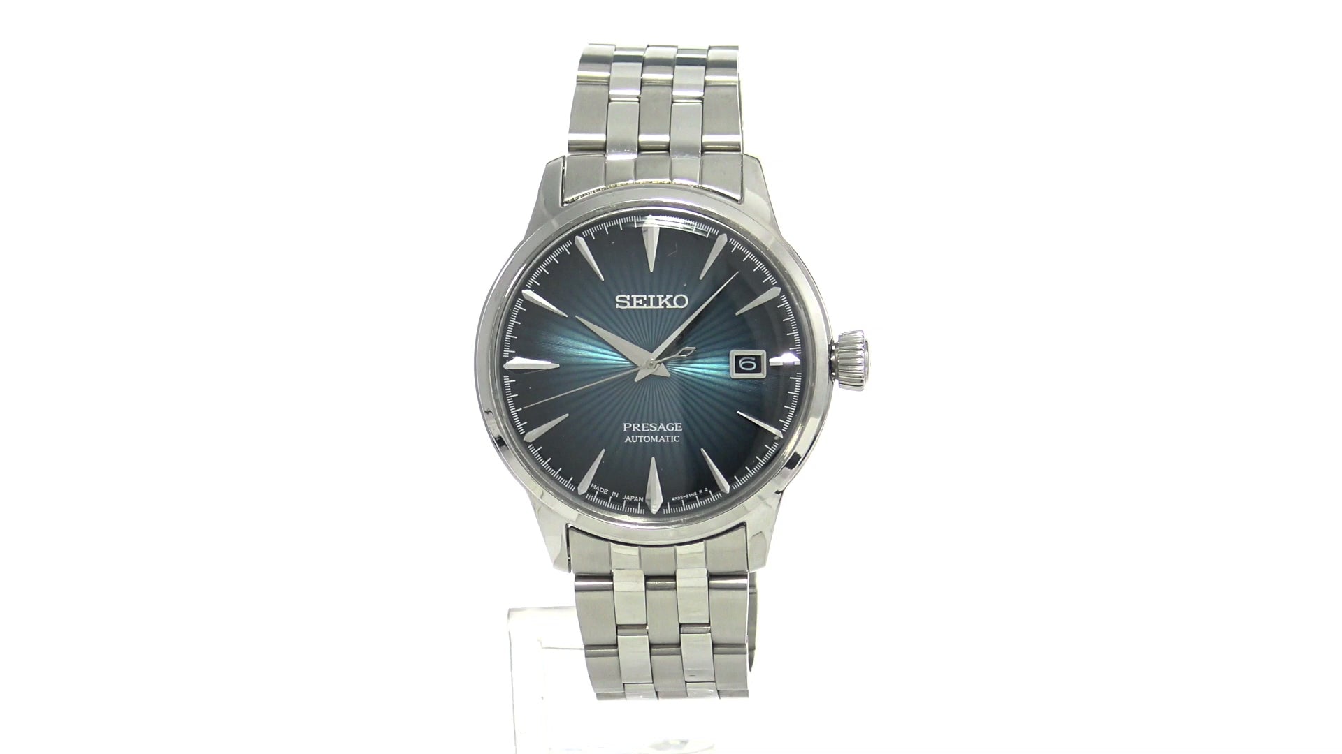 SEIKO Presage Cocktail Time – deep blue dial with pressed pattern and gloss finish, stainless steel case and bracelet, automatic 23-jewel movement, and 50m water resistance.