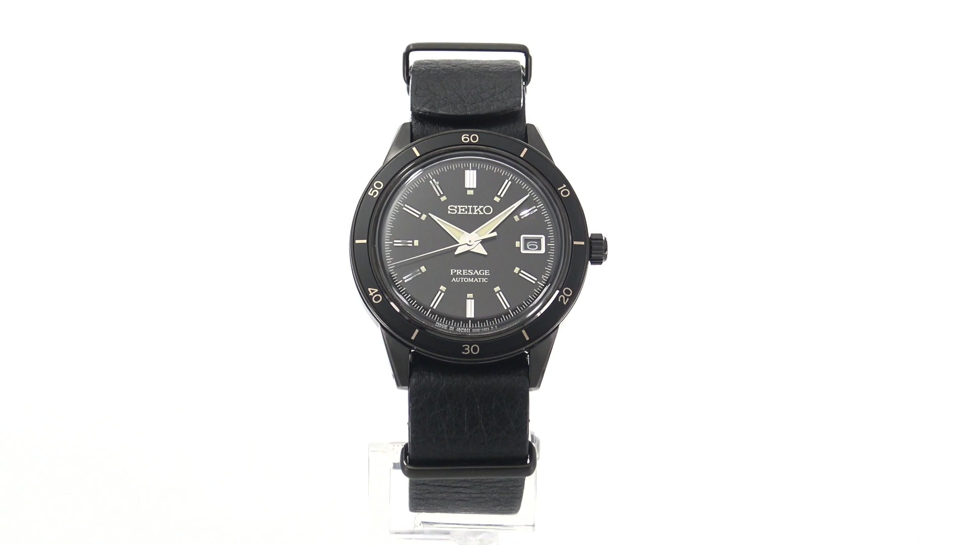 SEIKO SRPH95 from the Presage Style60’s Collection – black dial and bezel, beige LumiBrite hands, black deerskin strap, black hard-coated stainless steel case, automatic movement, and 50m water resistance.