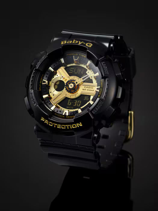 Black Casio G-Shock watch with gold accents on a dark background