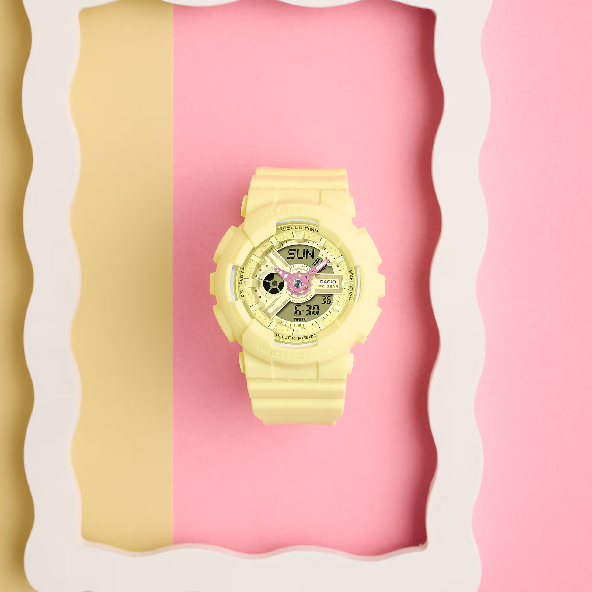 Yellow digital watch on a pink and yellow abstract background