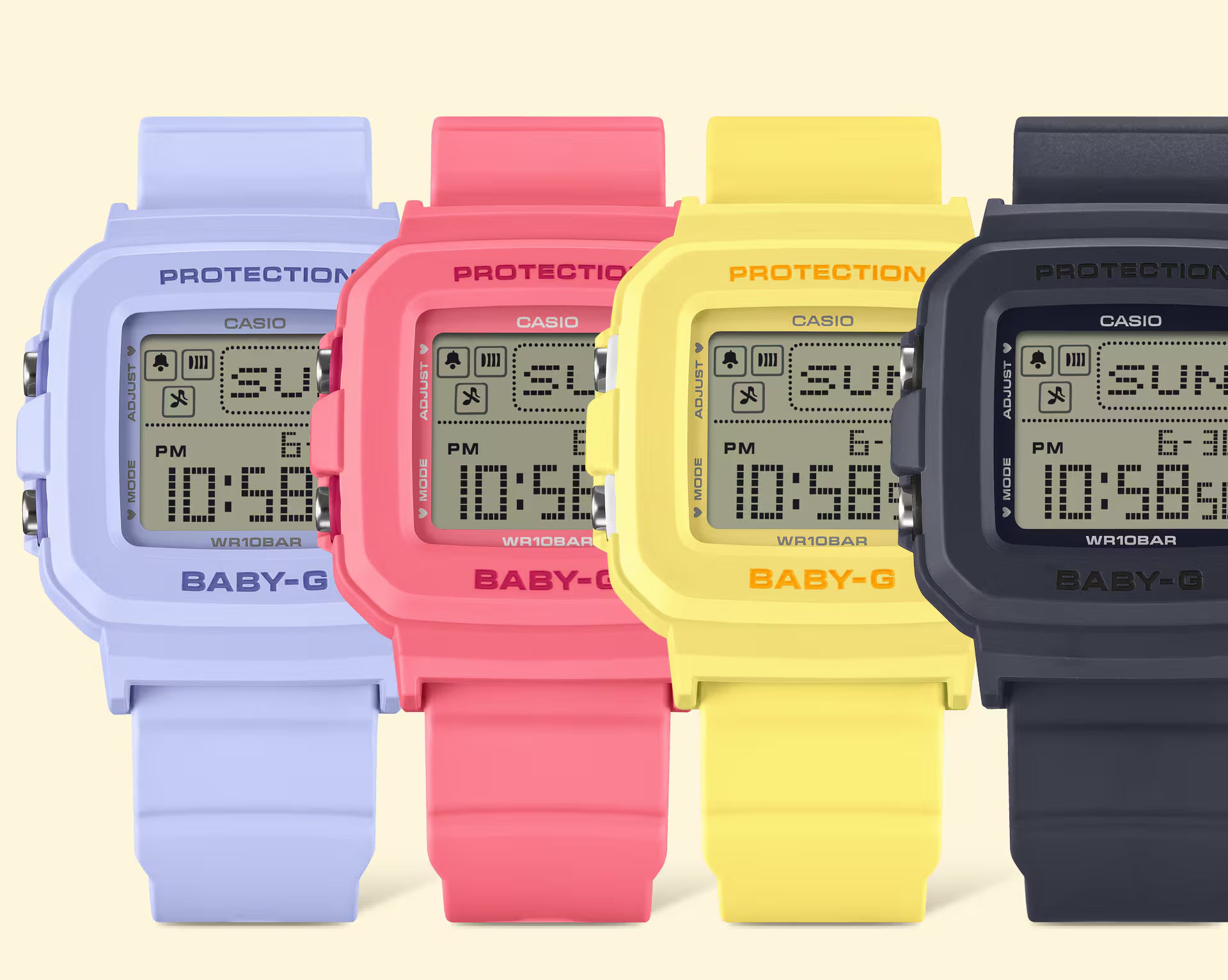 Four Casio Baby-G watches in different colors on a light beige background