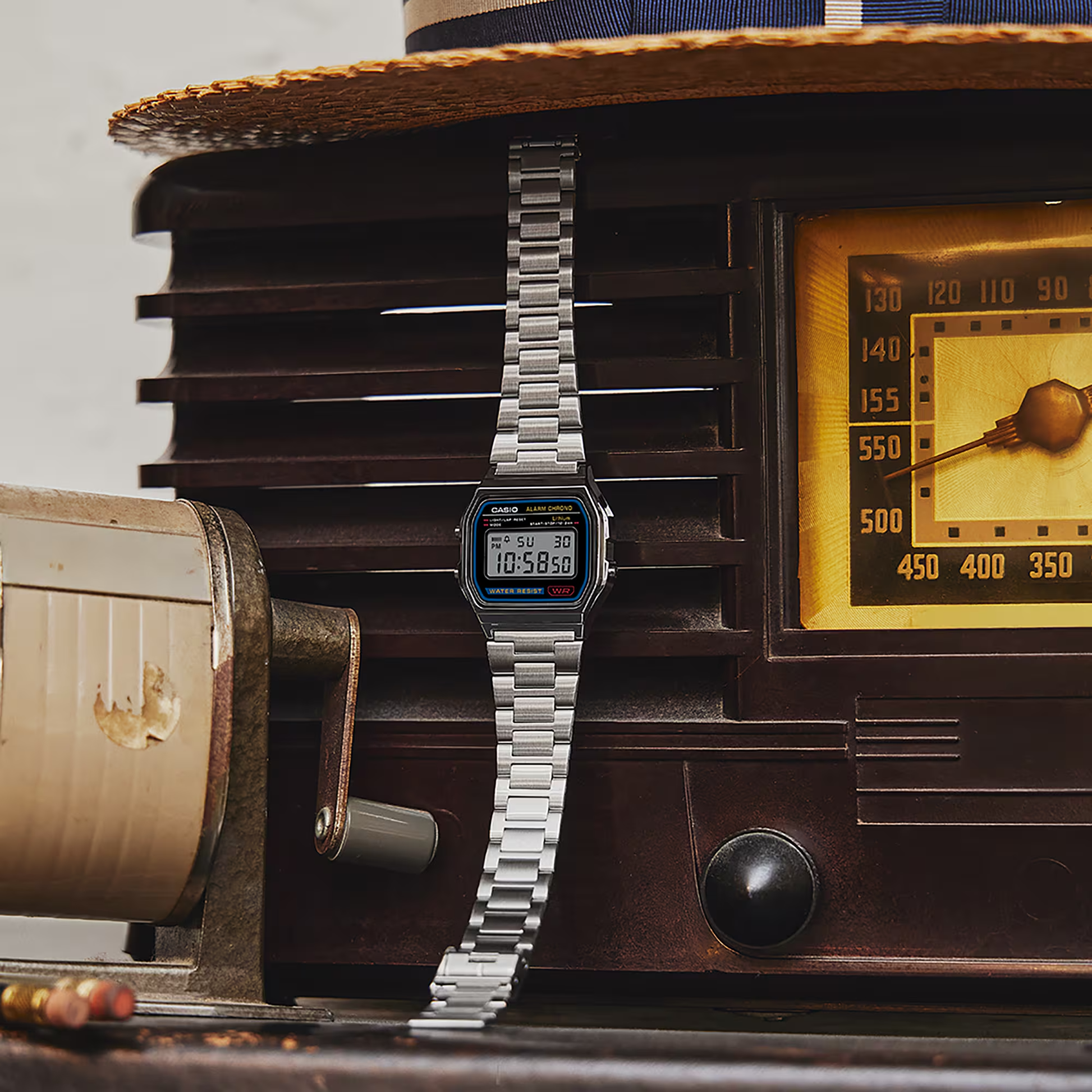 Digital watch on an old radio with a vintage aesthetic