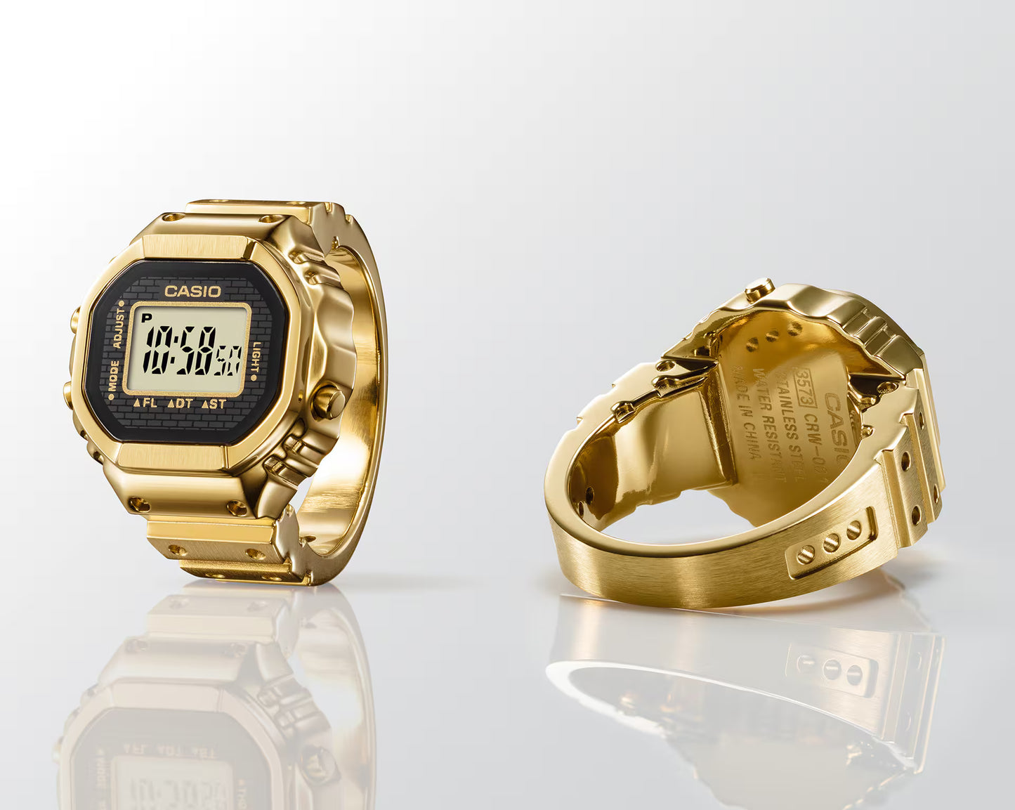Gold Casio watch with digital display on a white background