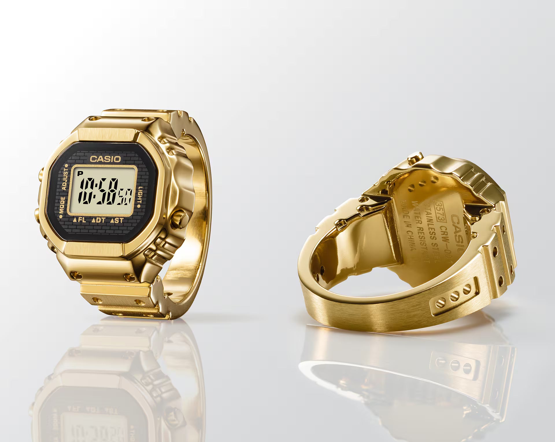 Gold Casio watch with digital display on a white background