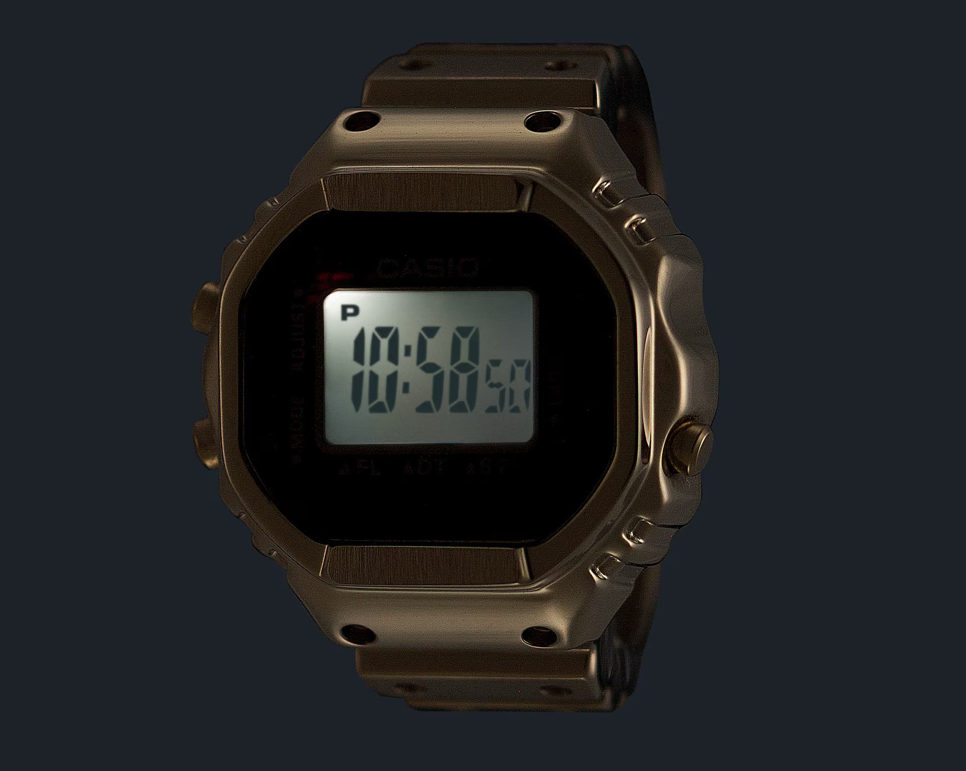 Digital watch with a bronze casing on a black background