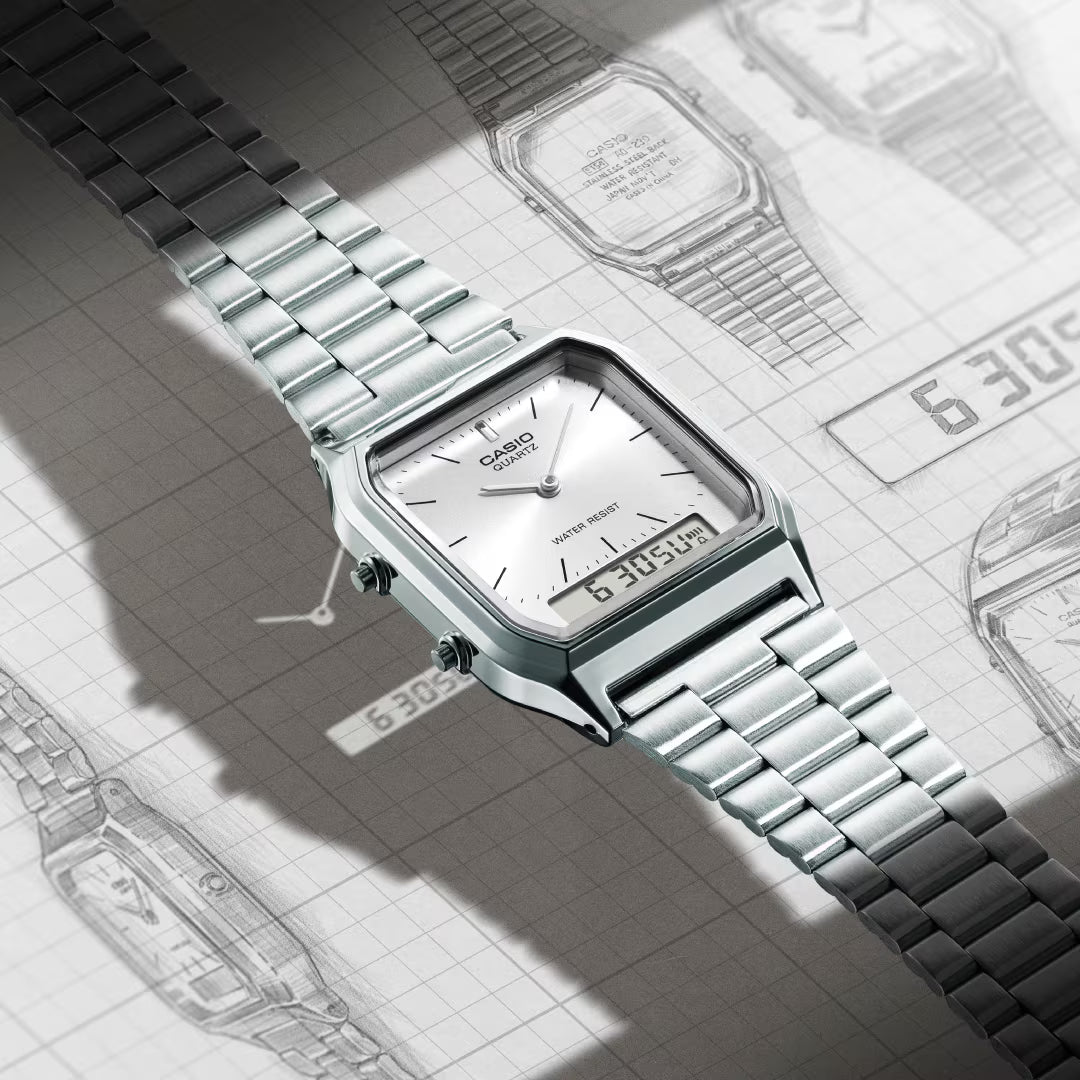 Silver Casio watch on a textured surface