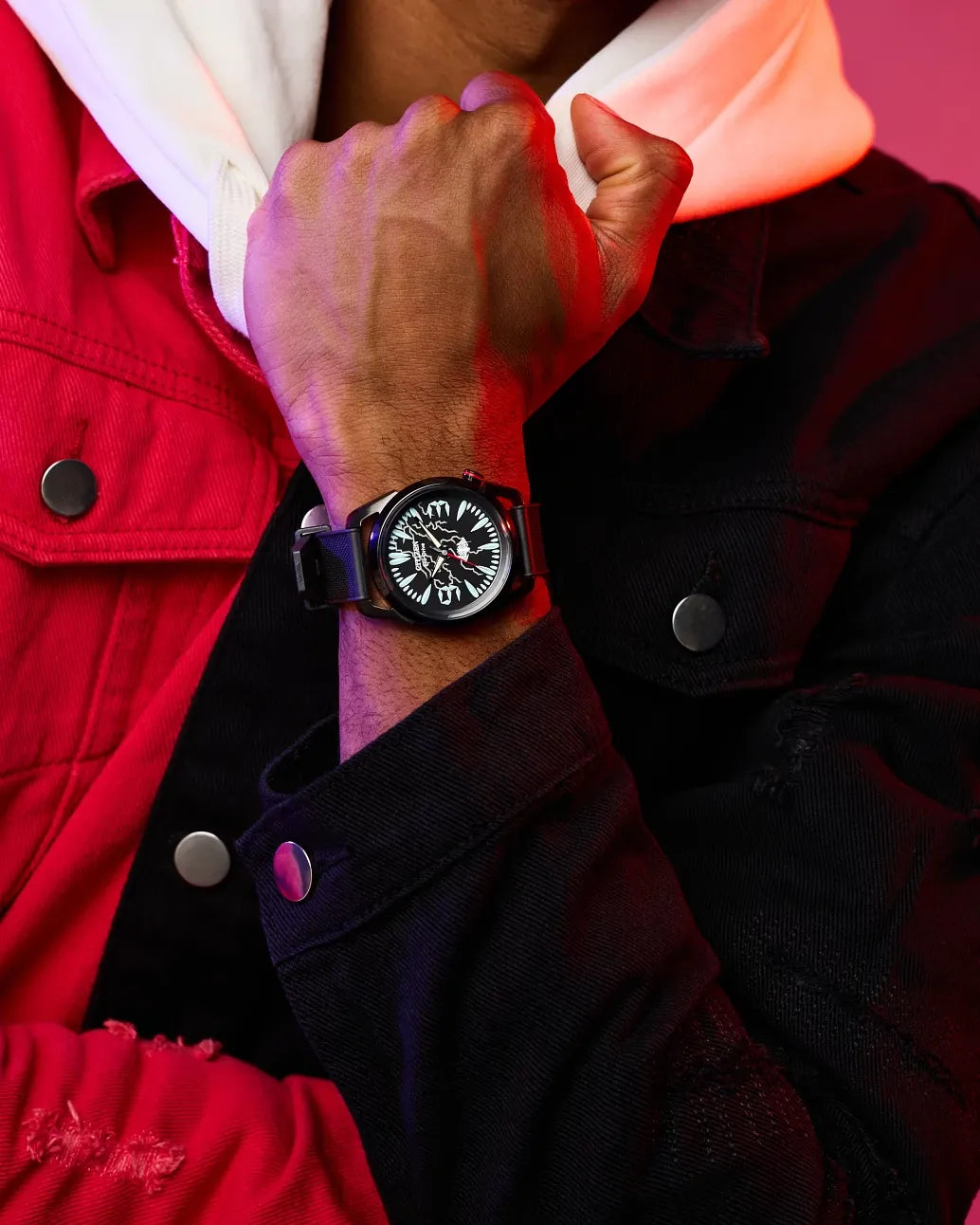 Citizen Venom Lethal Protector AW2065-41W Eco-Drive watch worn on wrist with red and black streetwear styling, featuring luminous Venom teeth markers and black polyurethane strap.